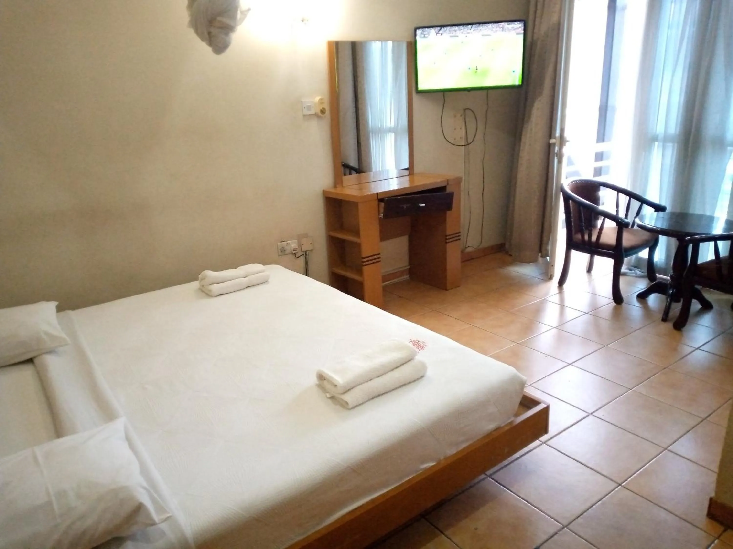 Bed in DOUBLE FIVE HOTEL