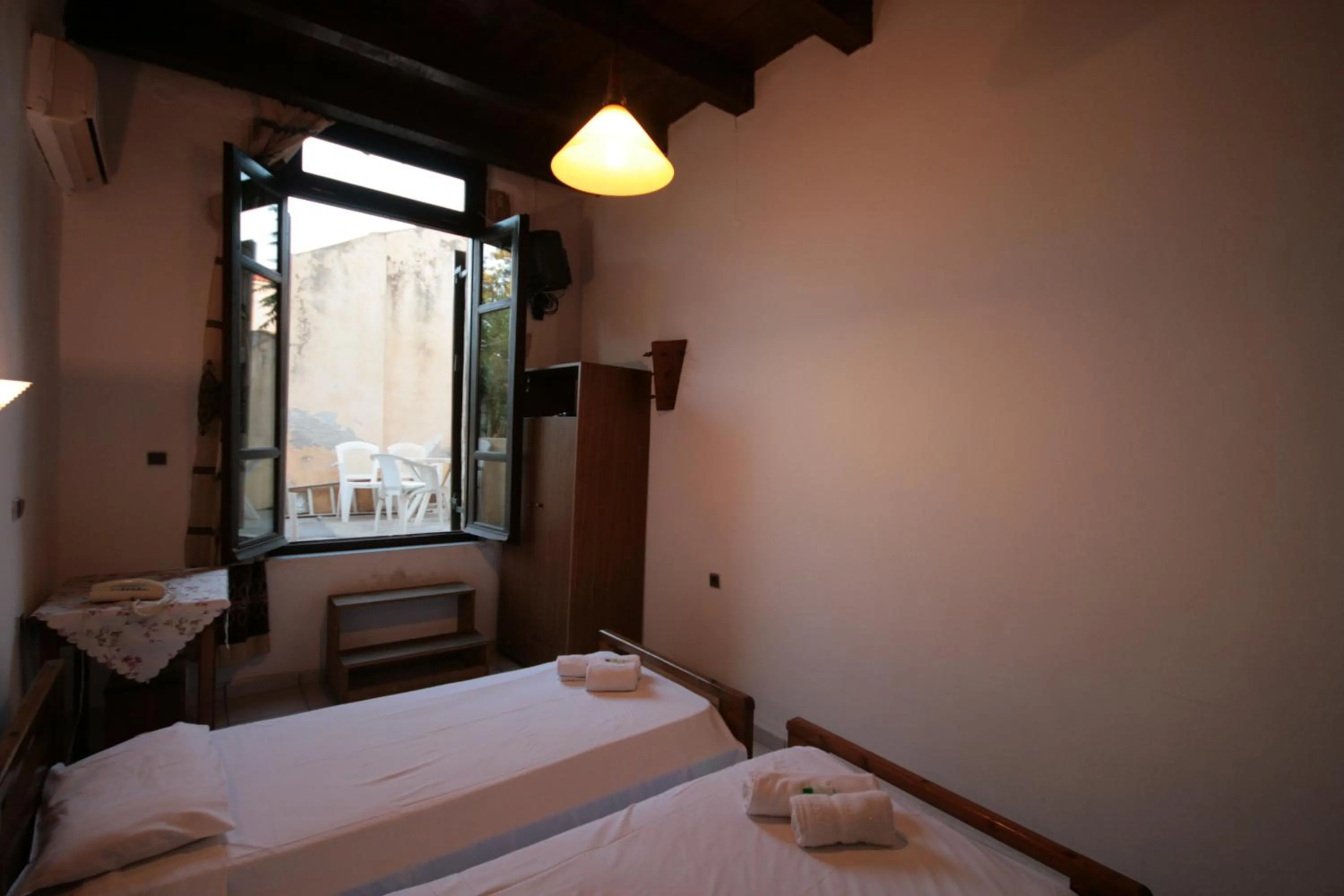 Bed in Chania Rooms