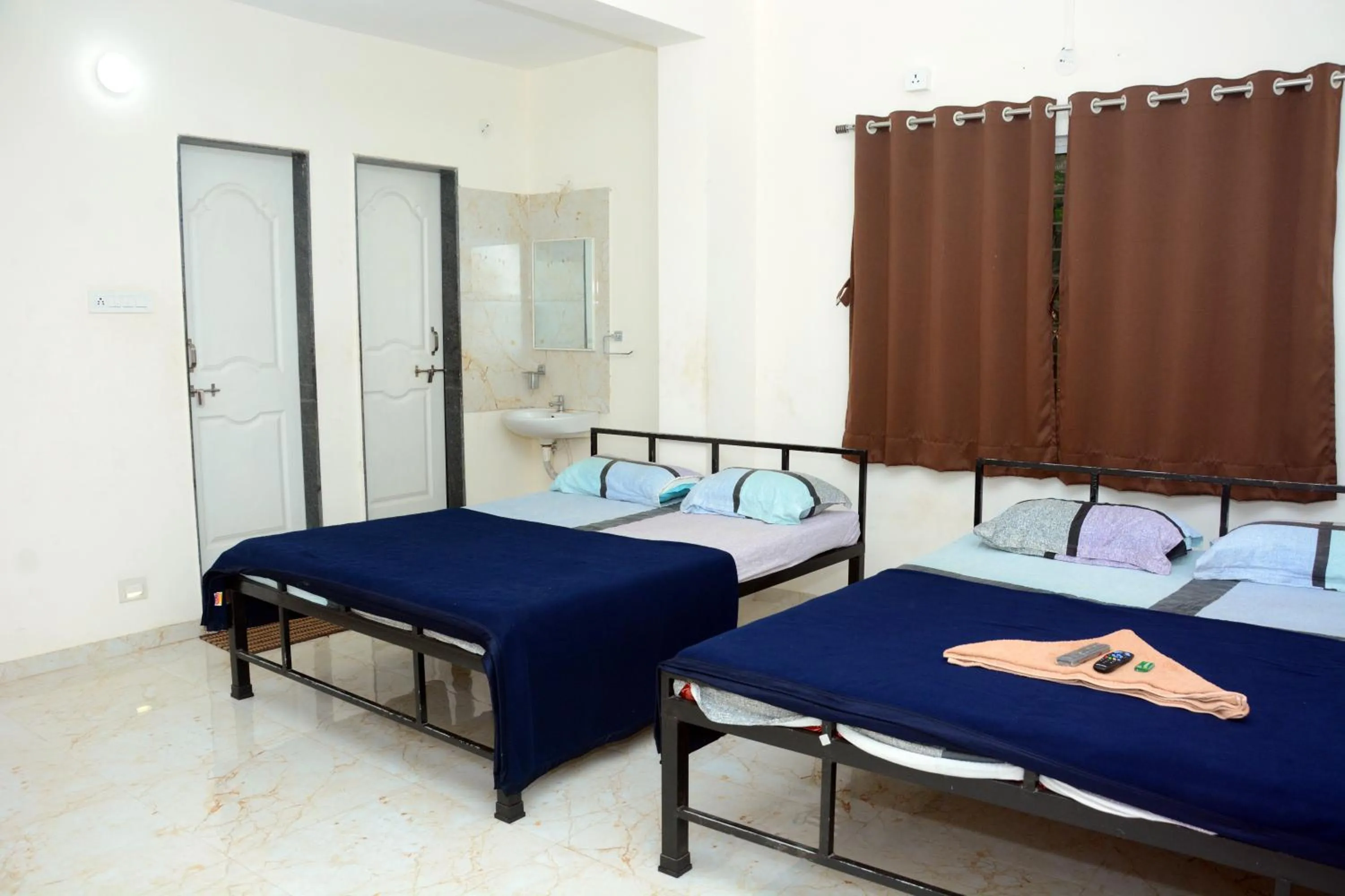 Bed in Shree Swami Samarth Resort