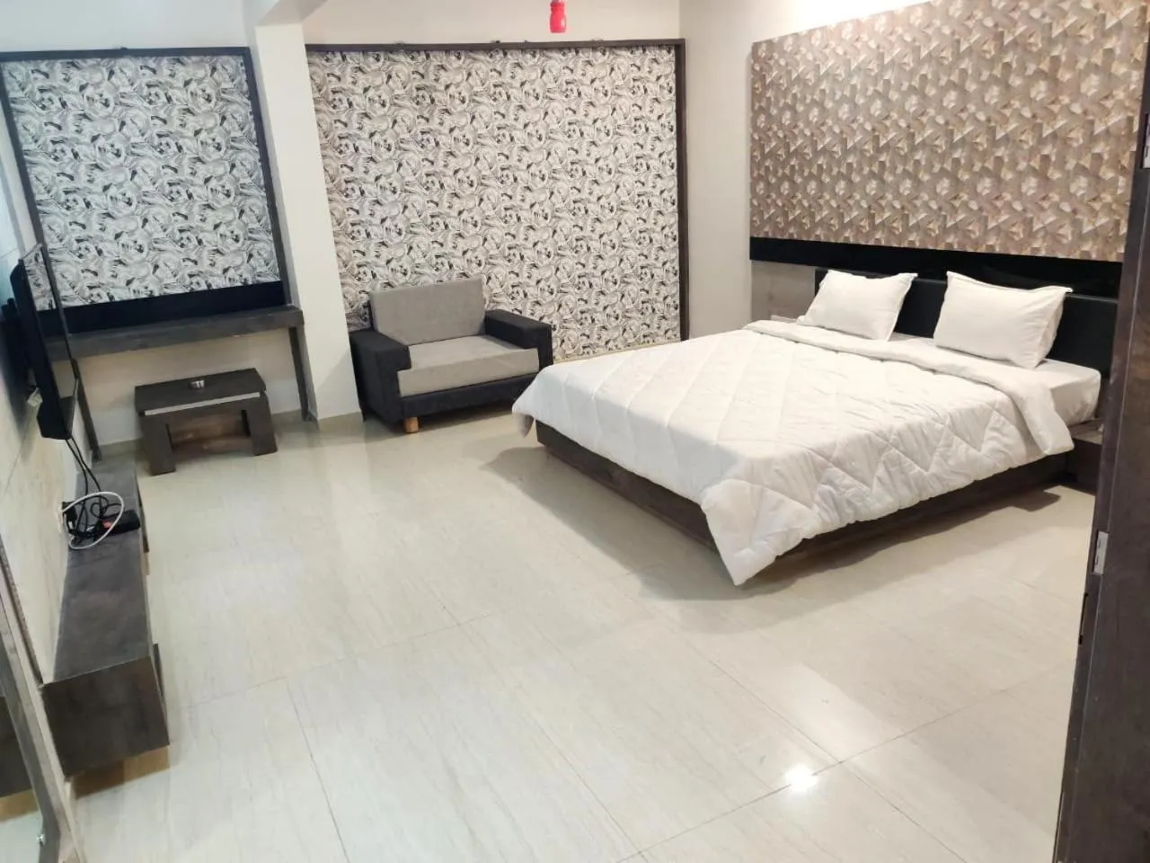 Bed in The Grand Takshak Hotel