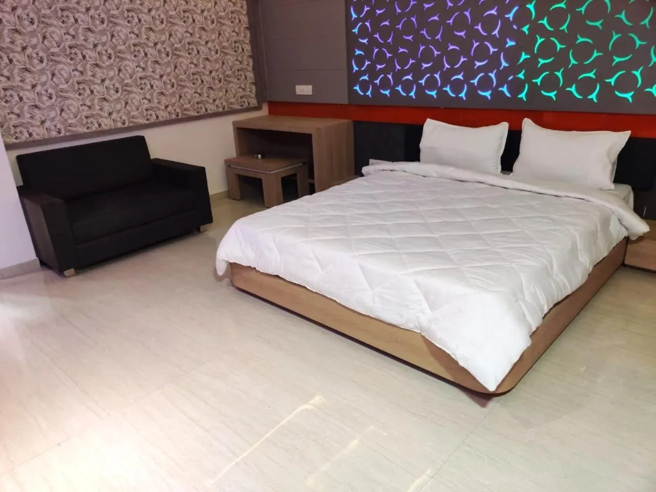 Bed in The Grand Takshak Hotel