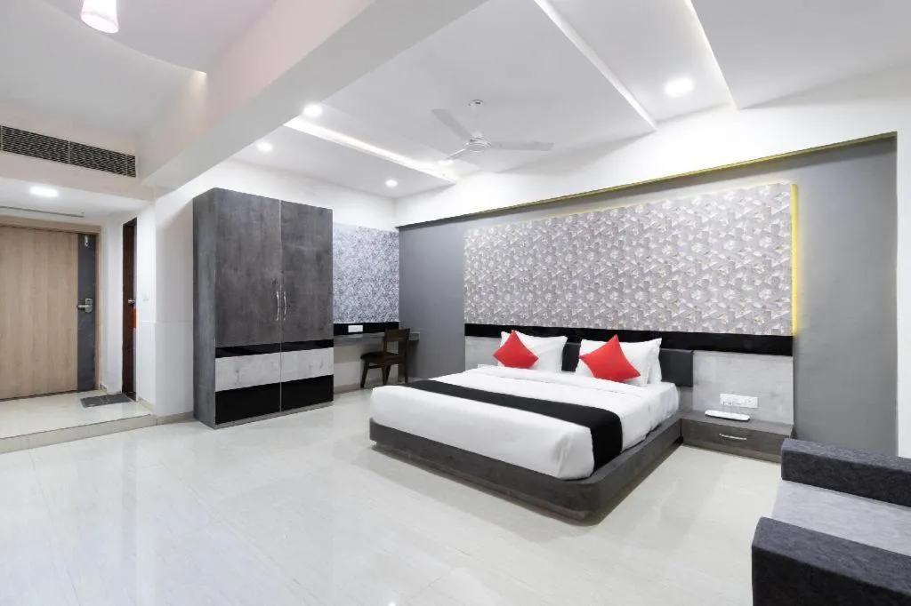 Bed in The Grand Takshak Hotel