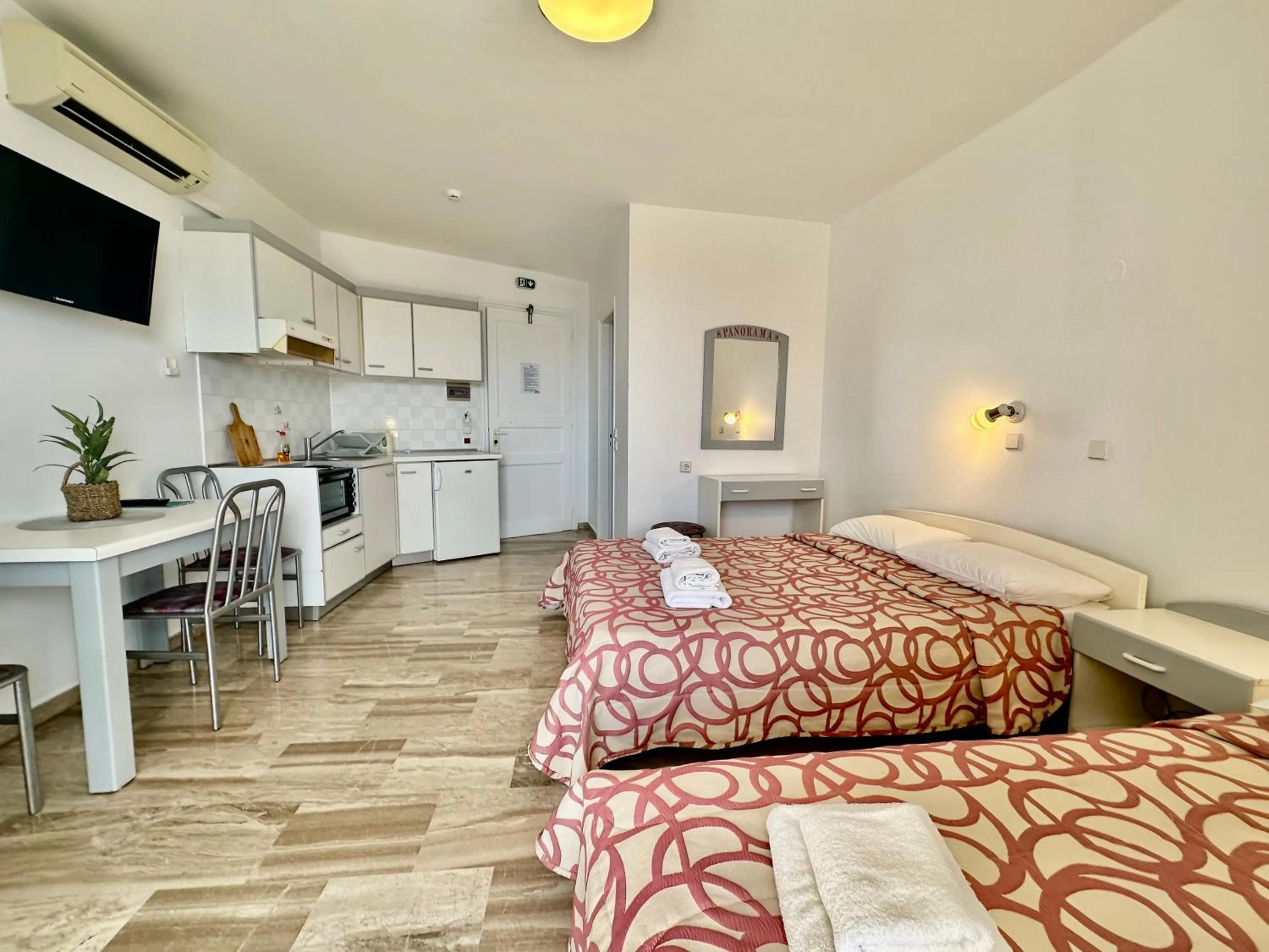 Bed in Hotel Apartments Panorama