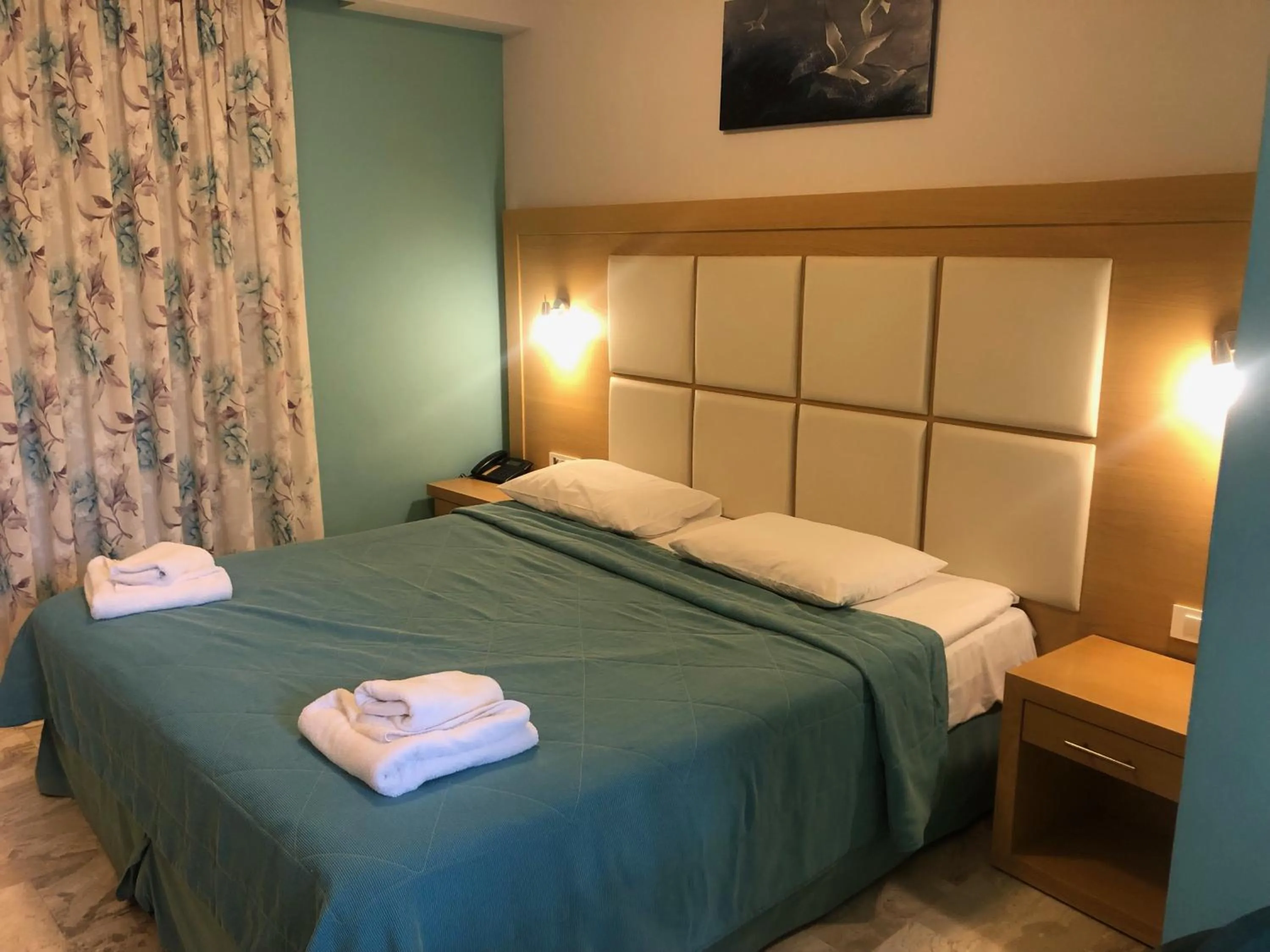 Bed in Hotel Apartments Panorama