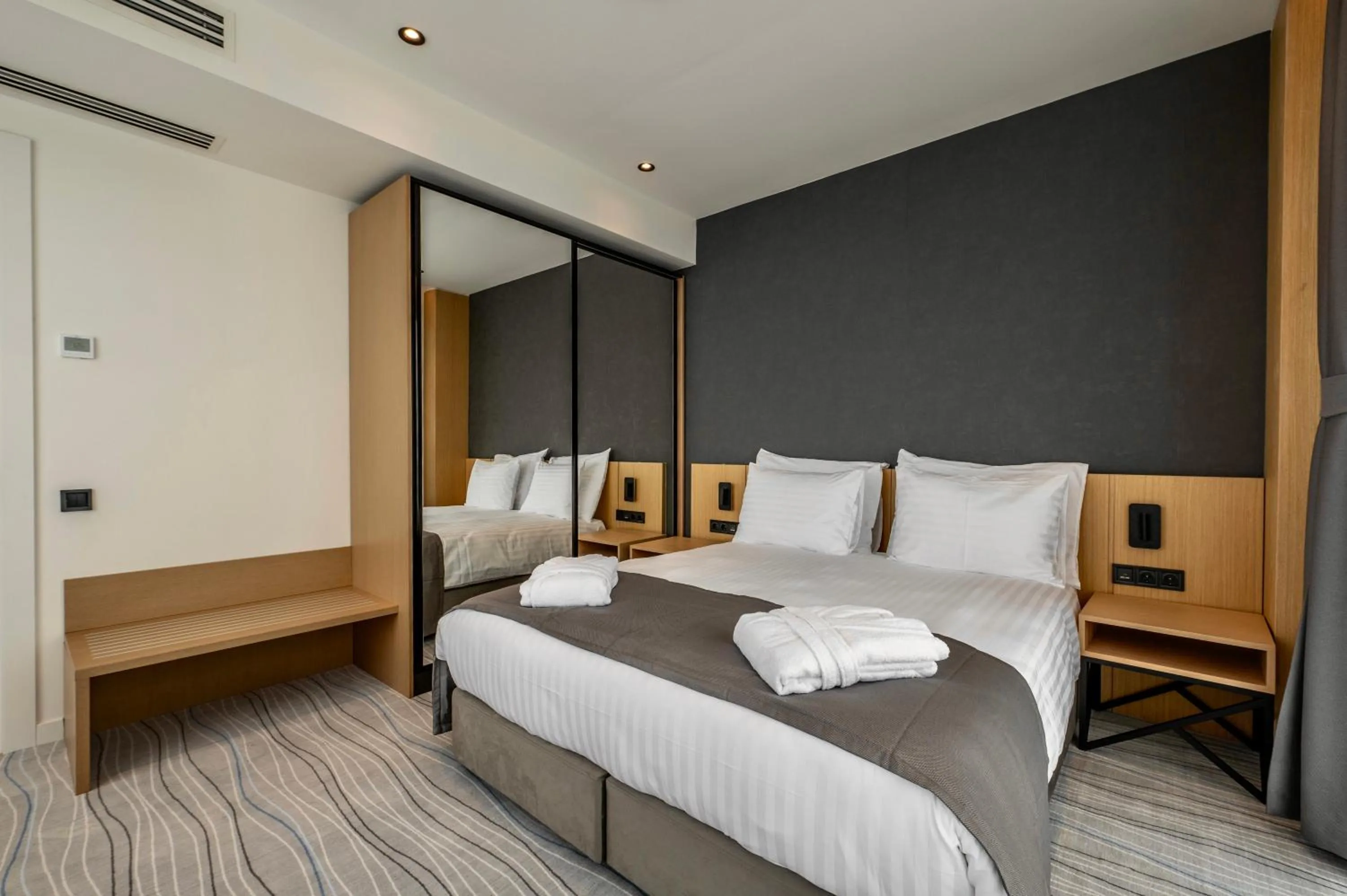 Bed in The Grandeur Hotel