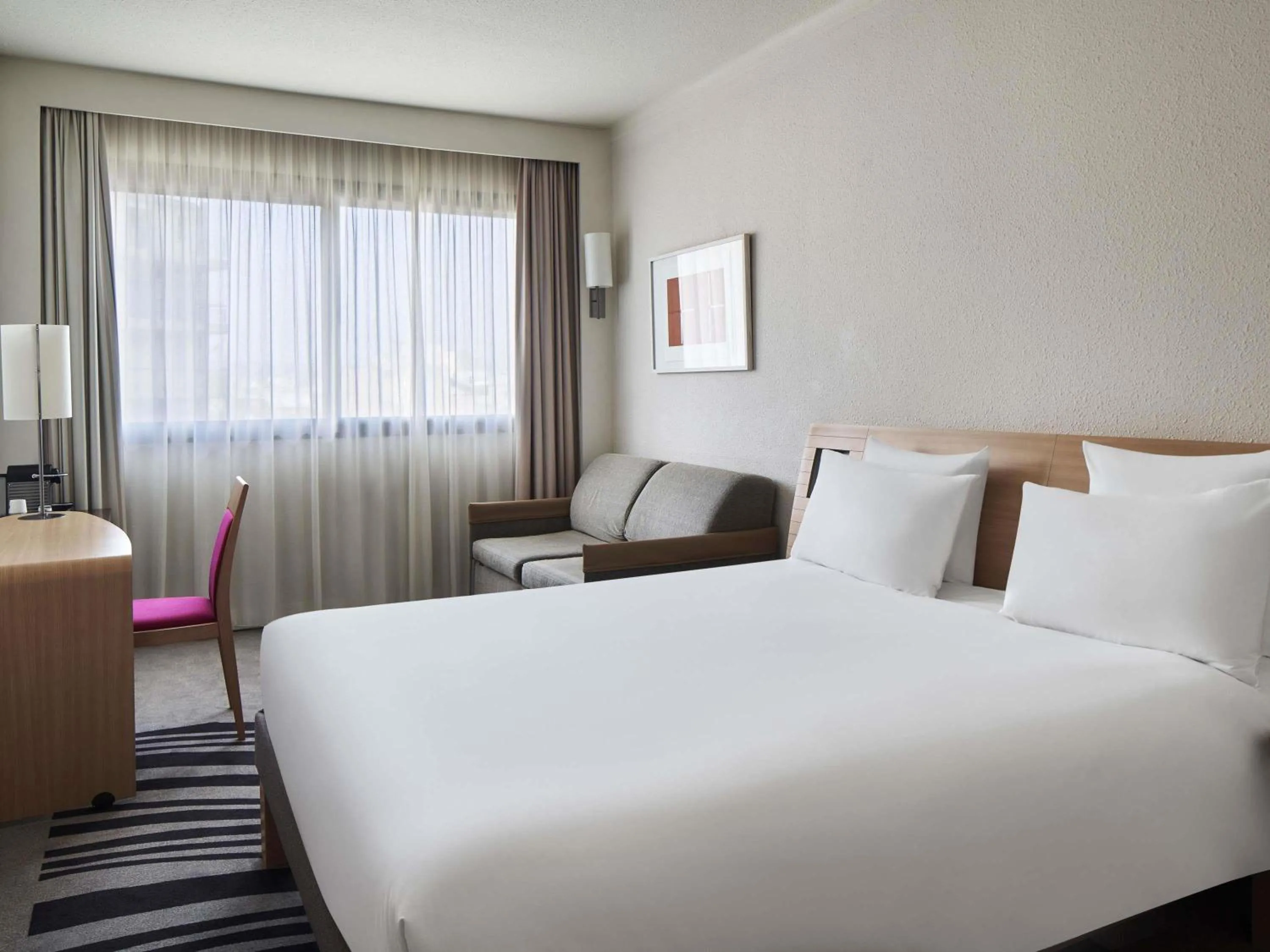 Family Room with One Double Bed and One Double Sofa Bed in Novotel Athens