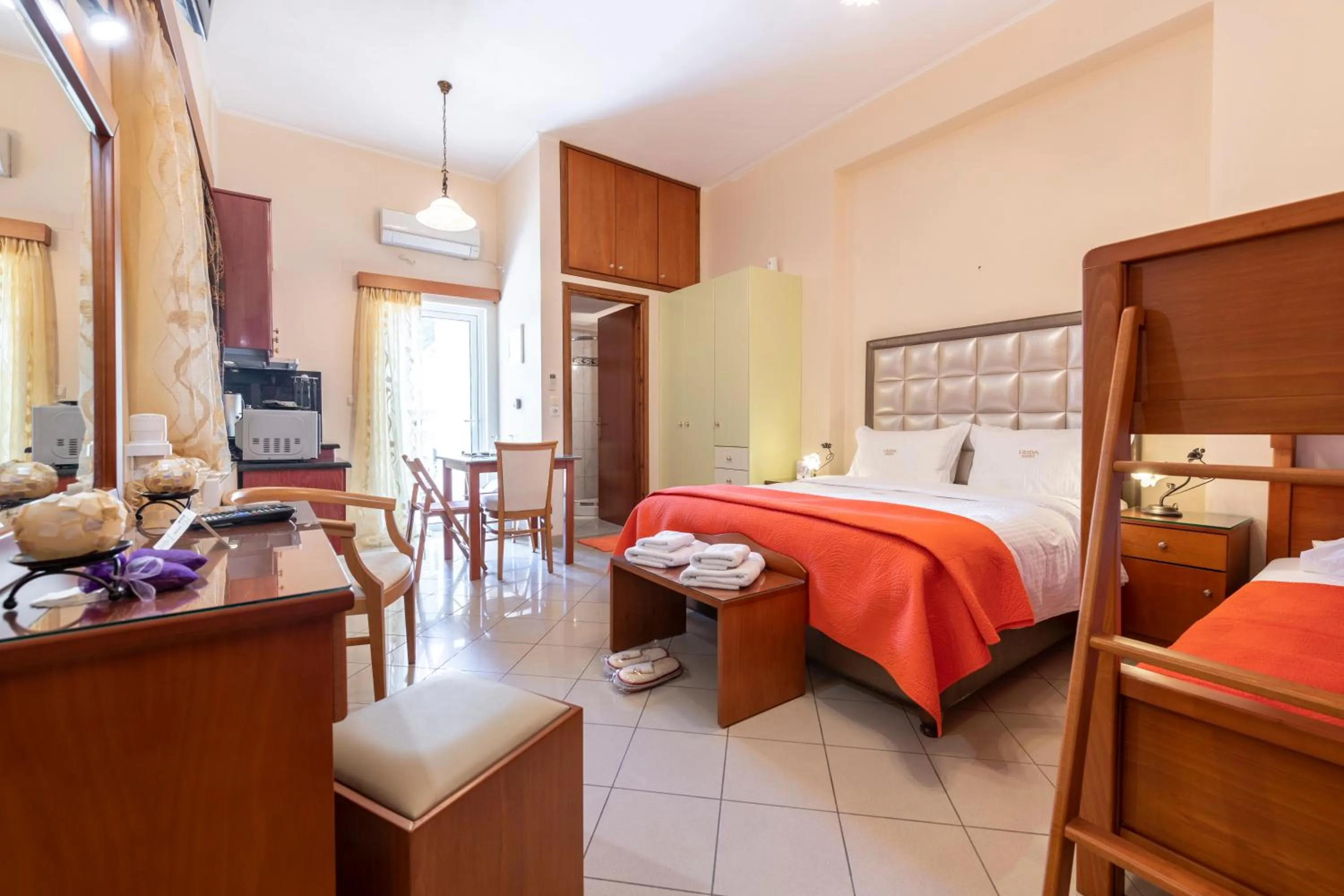 Bed in Irida Beach Resort Suites