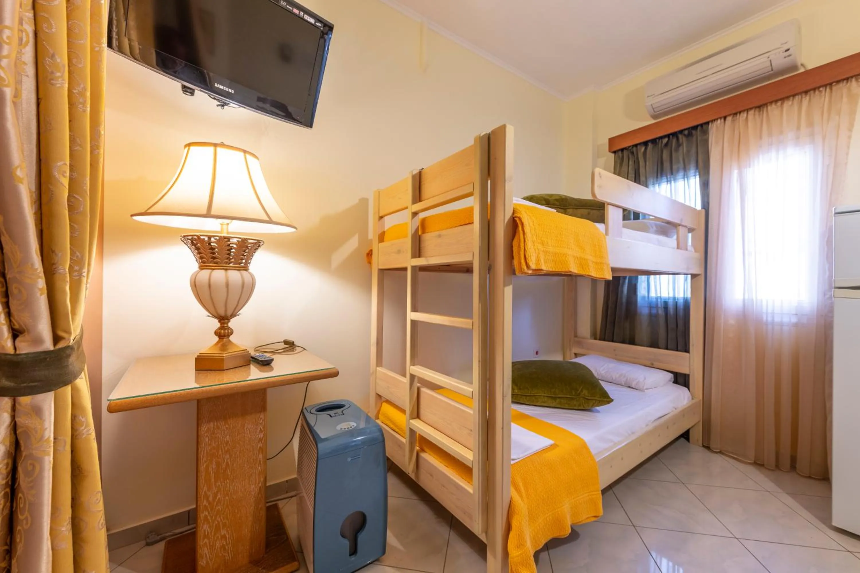 Bed in Irida Beach Resort Suites