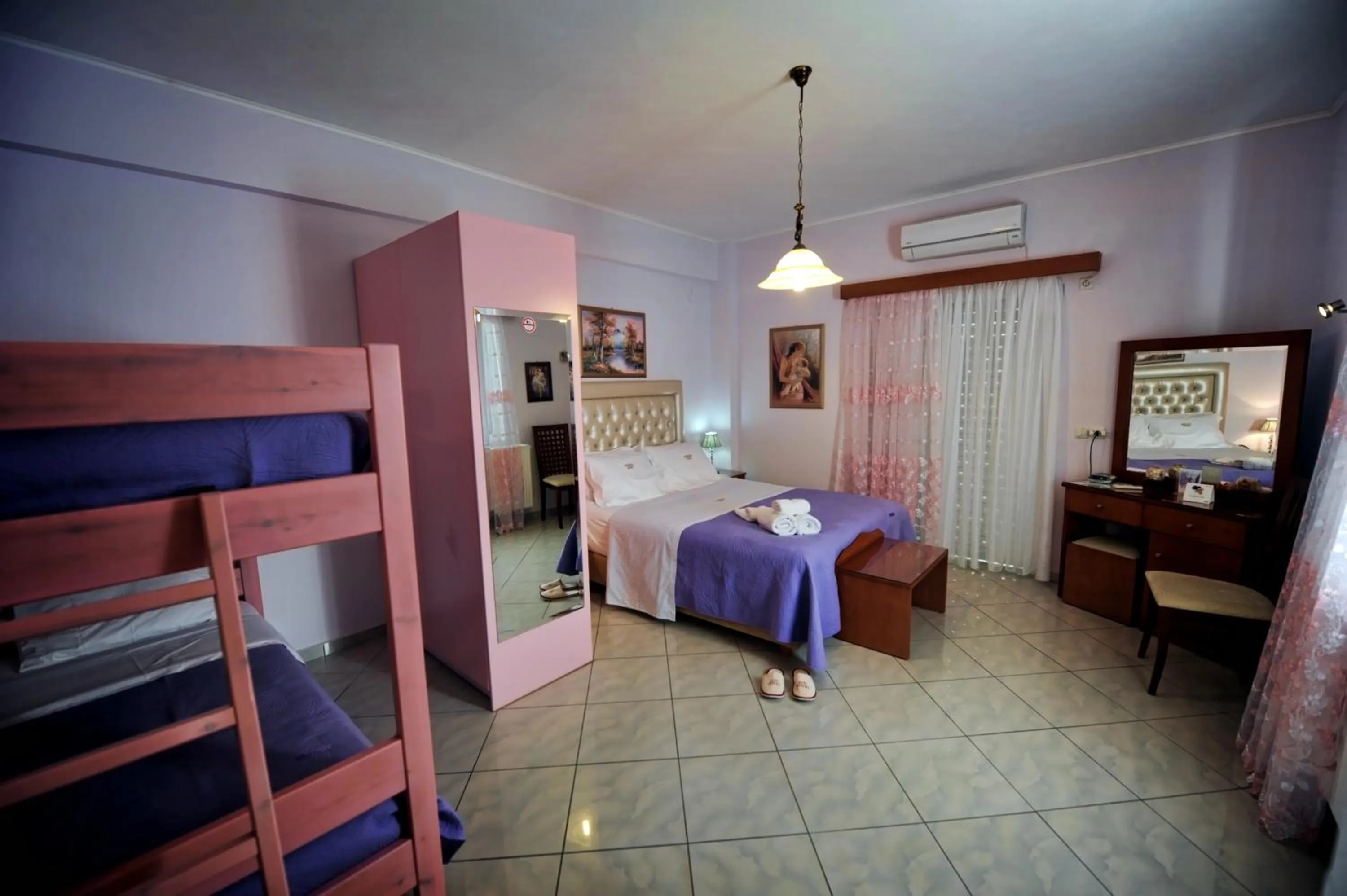 Bed in Irida Beach Resort Suites