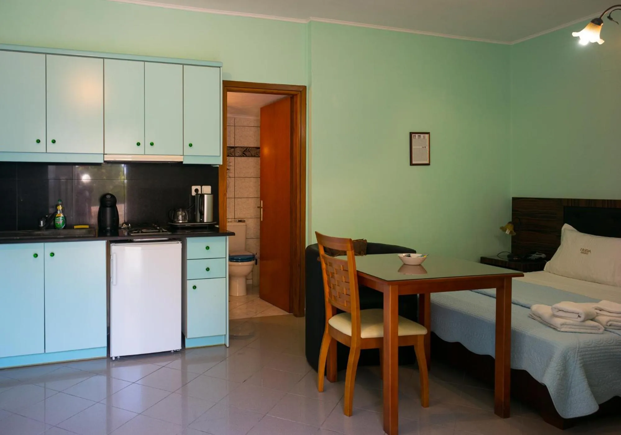 Bed in Irida Beach Resort Suites