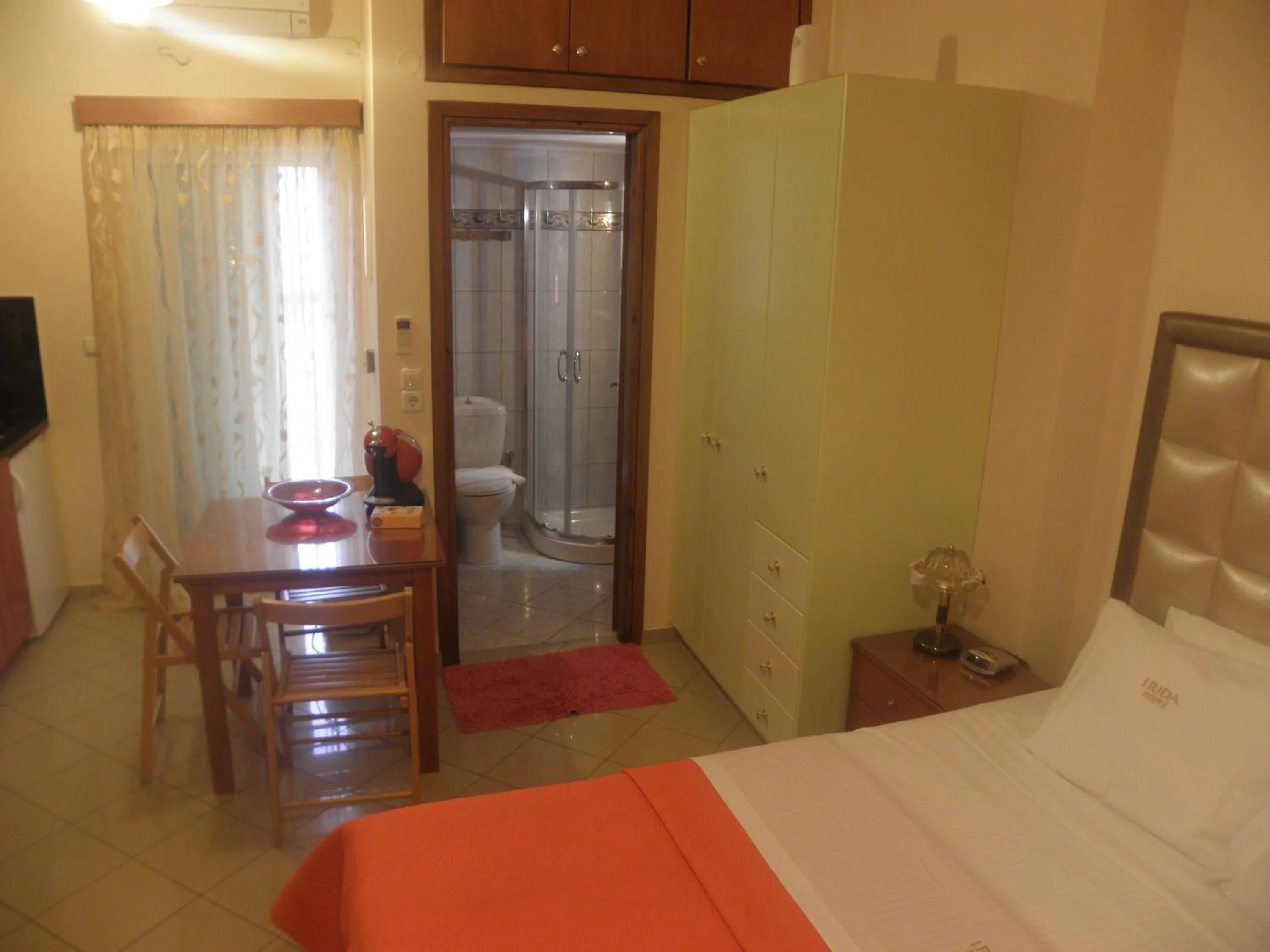 Shower, Bed in Irida Beach Resort Suites