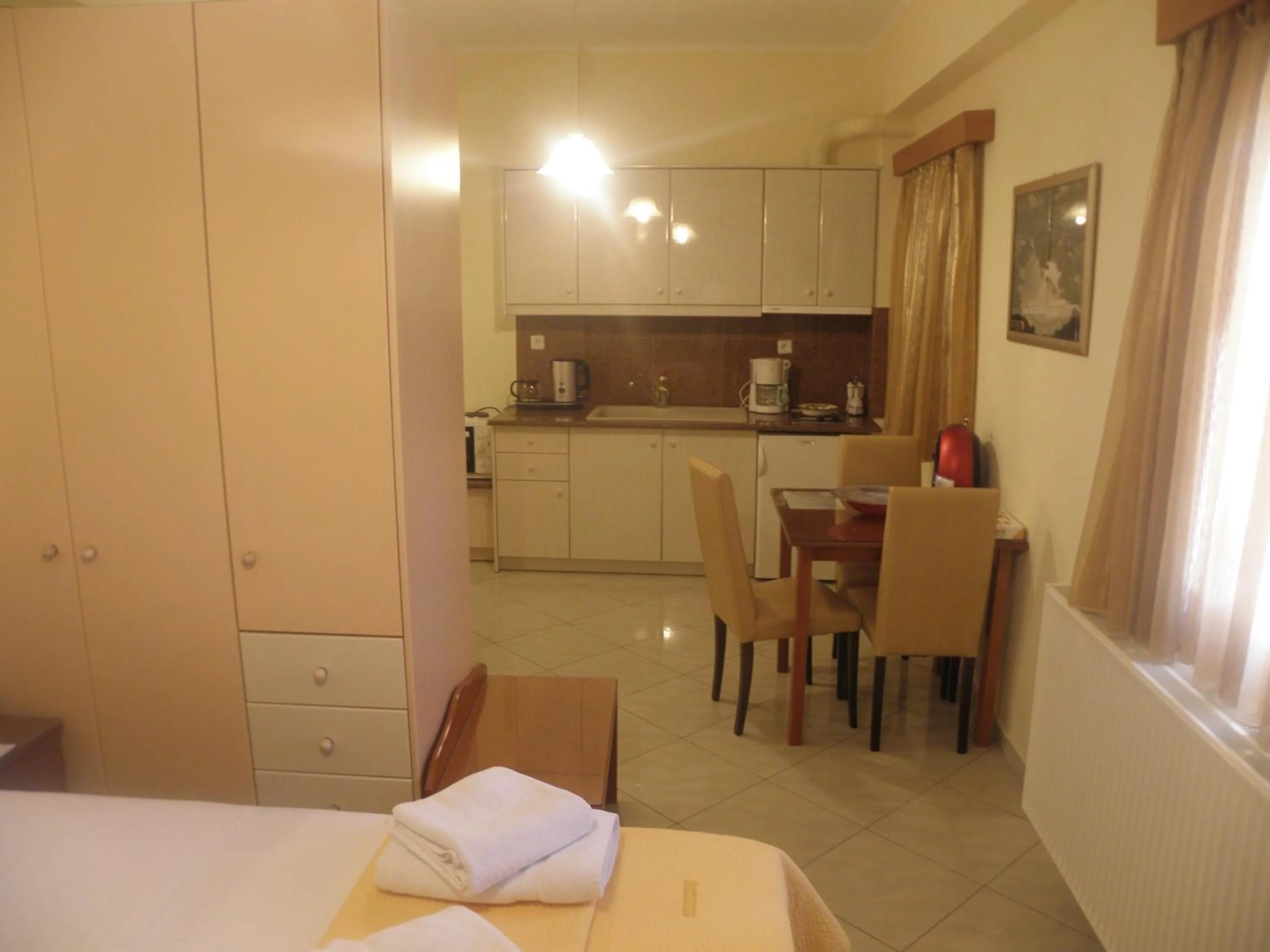 Coffee/tea facilities, Bed in Irida Beach Resort Suites