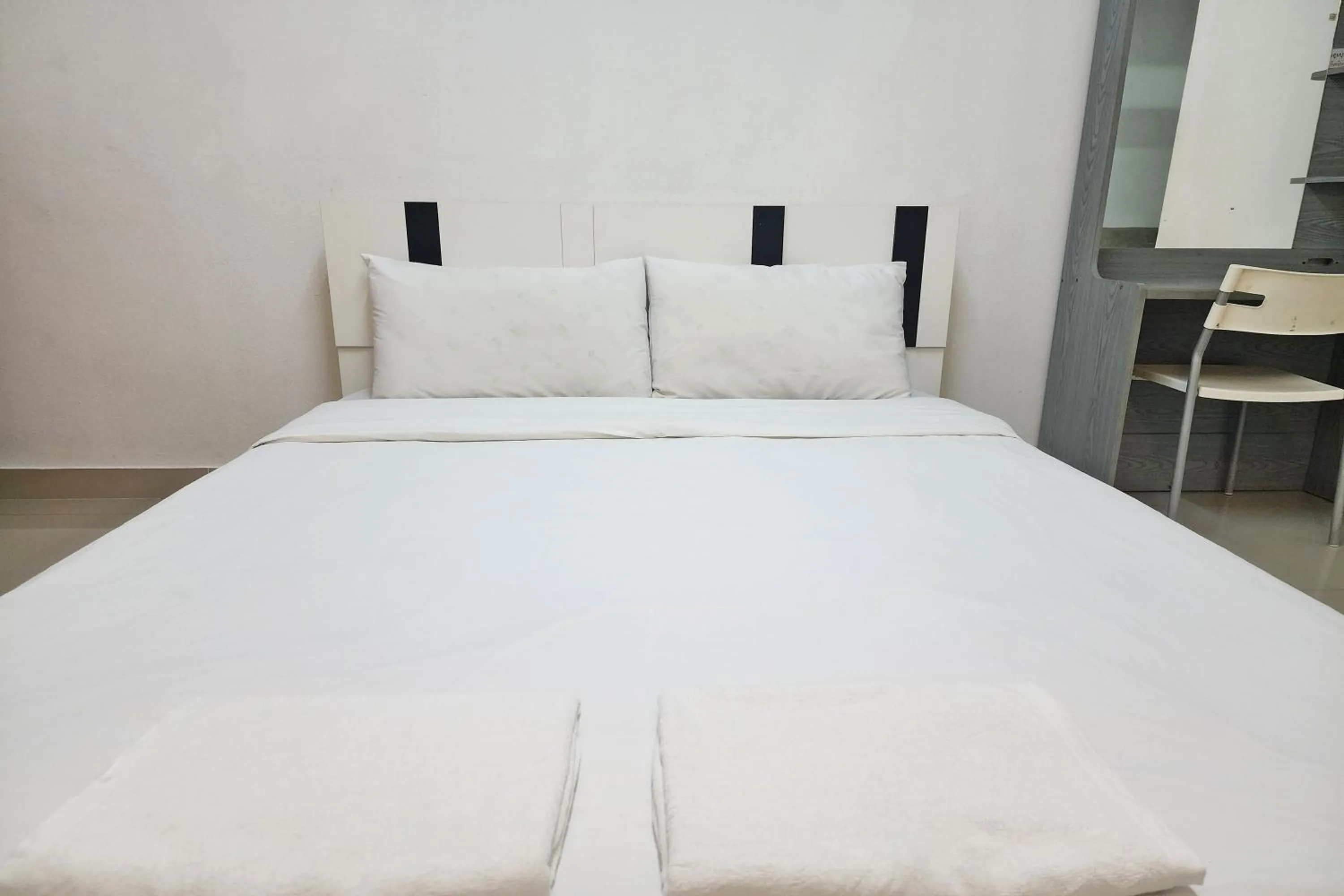 Bed in Green Apartment Kaset