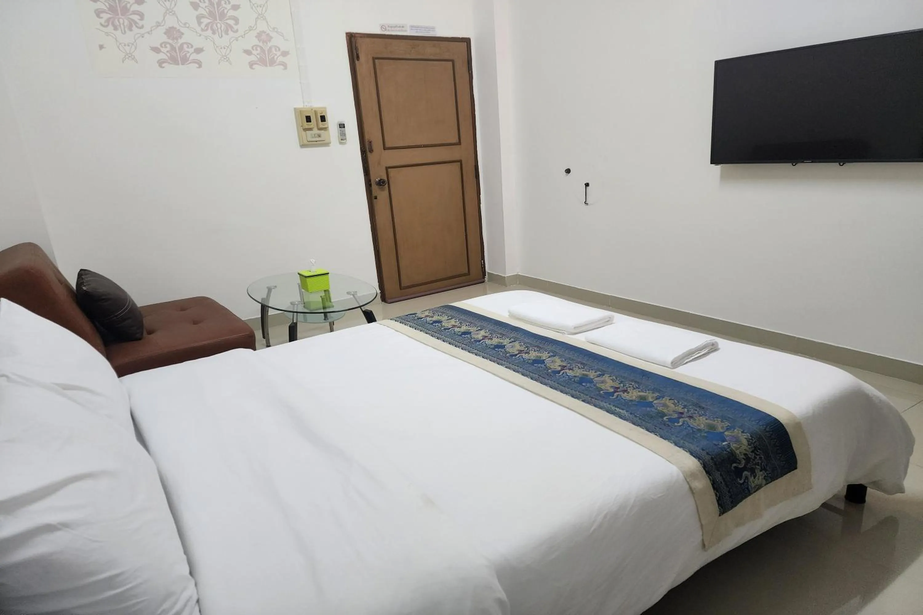 Bed in Green Apartment Kaset