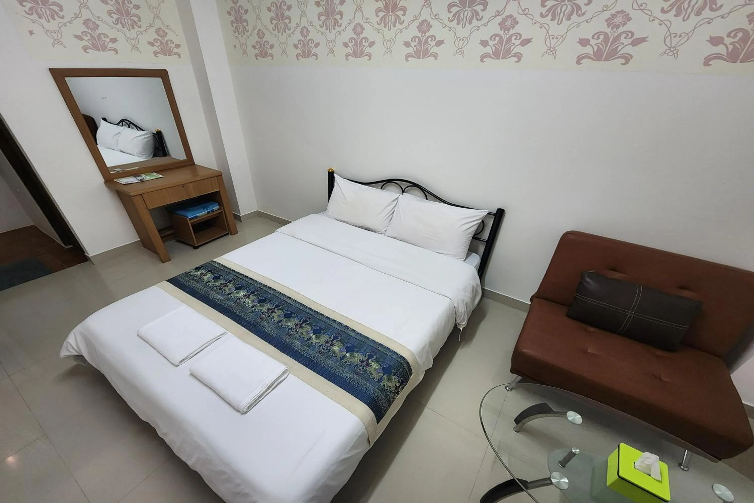 Bed in Green Apartment Kaset