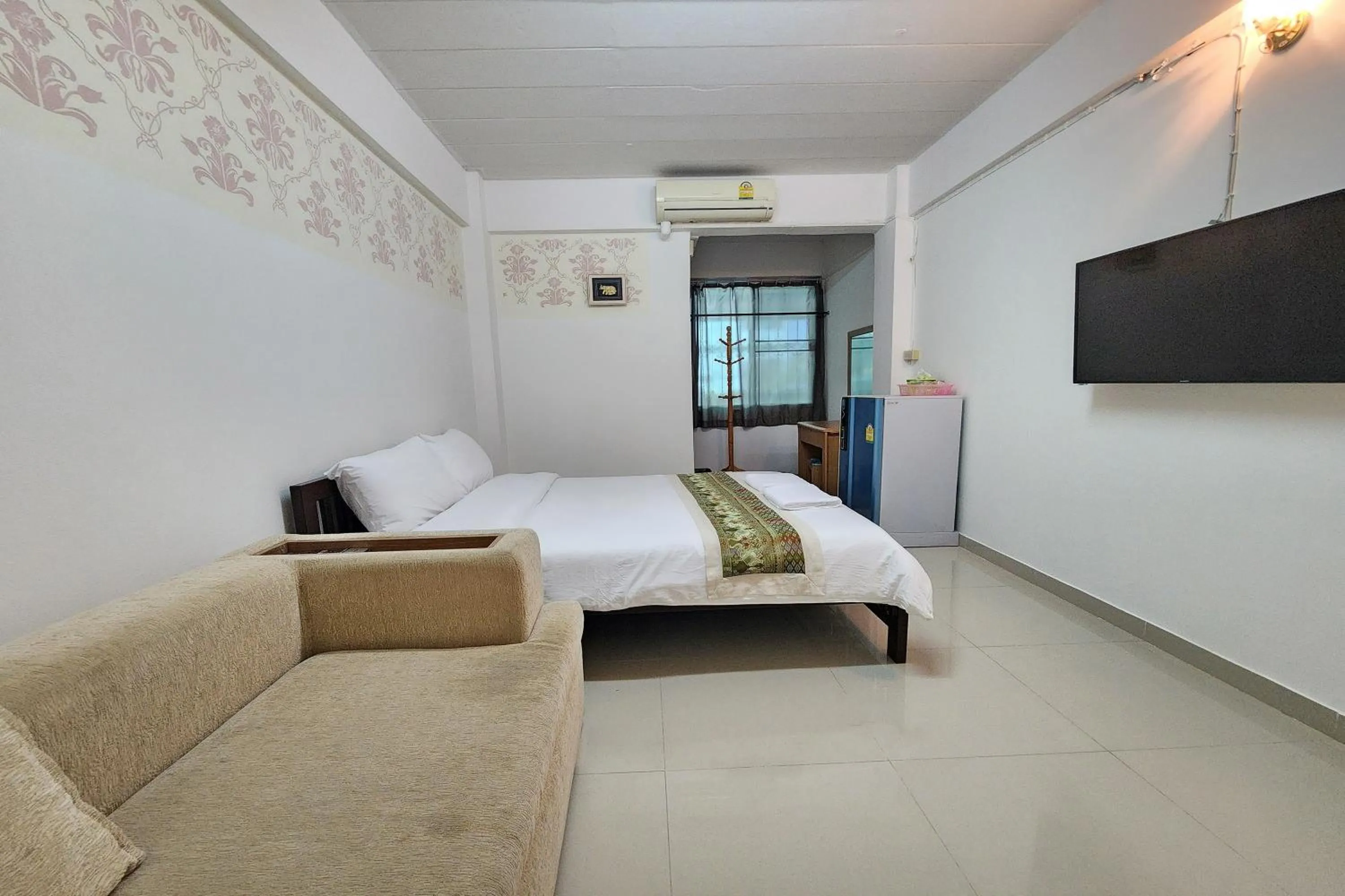 Bed in Green Apartment Kaset