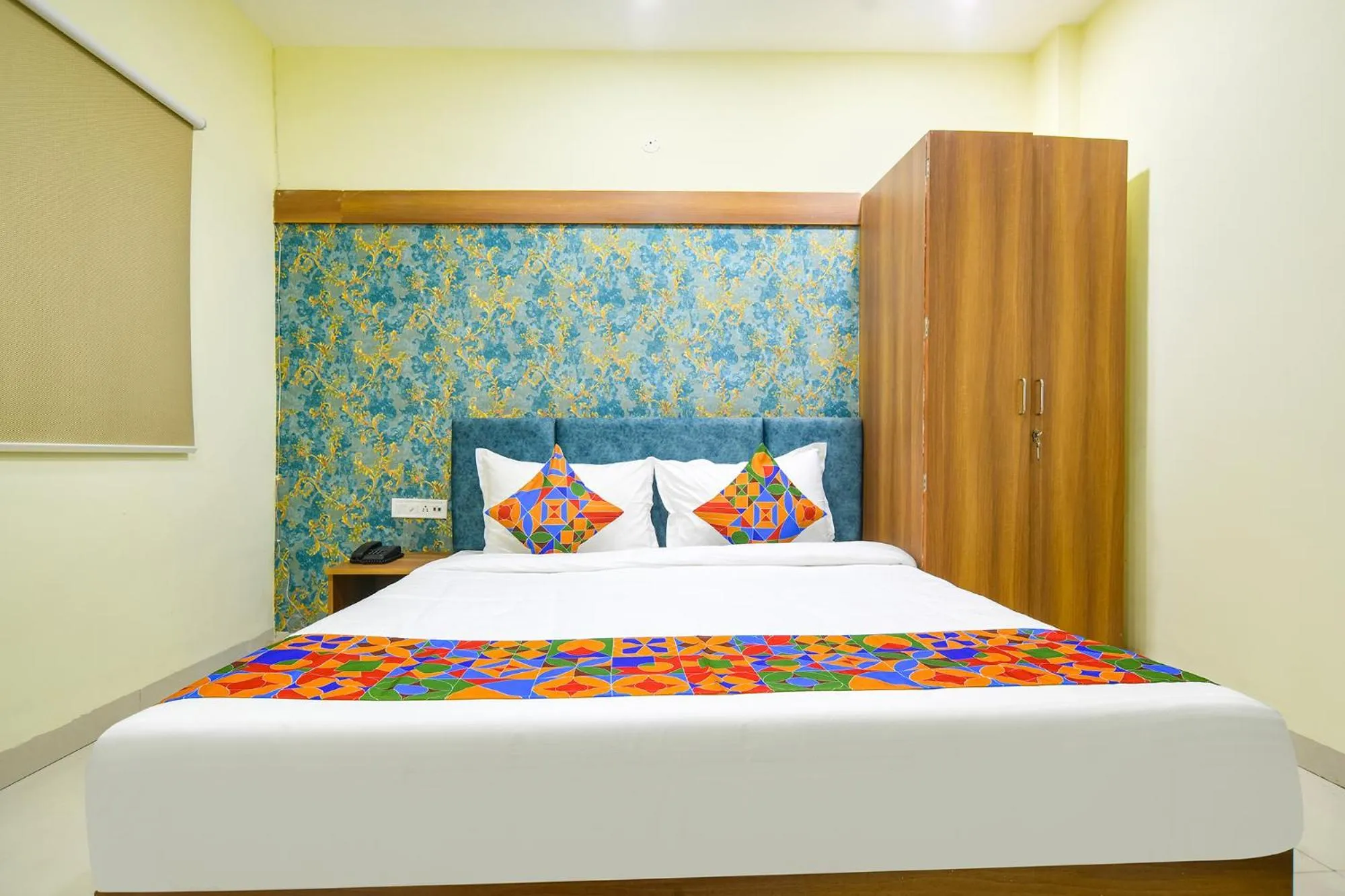 Bed in FabHotel Grand Giriraj