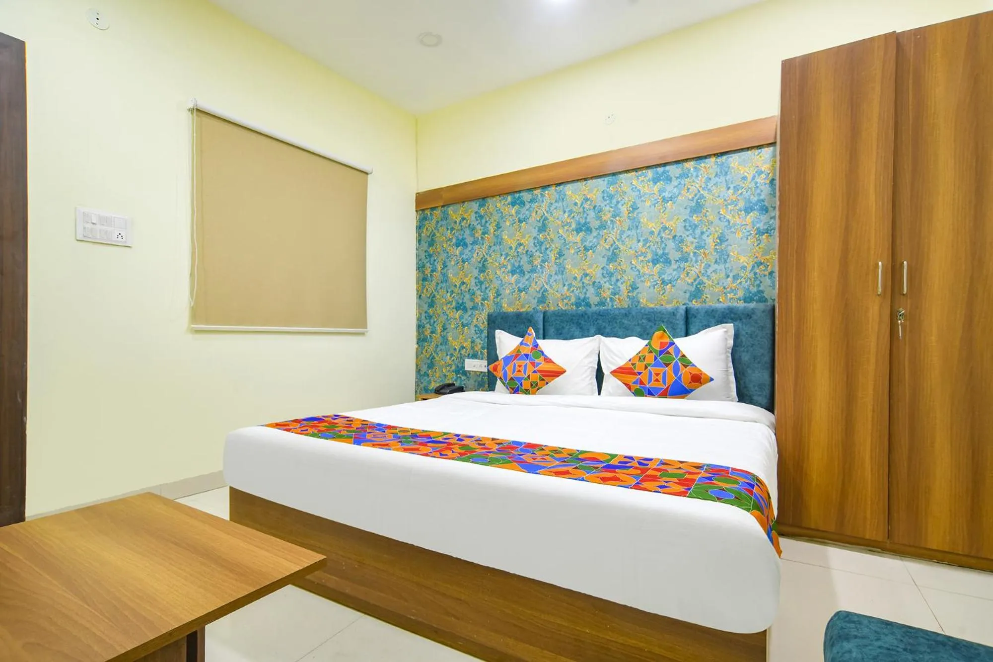 Bed in FabHotel Grand Giriraj