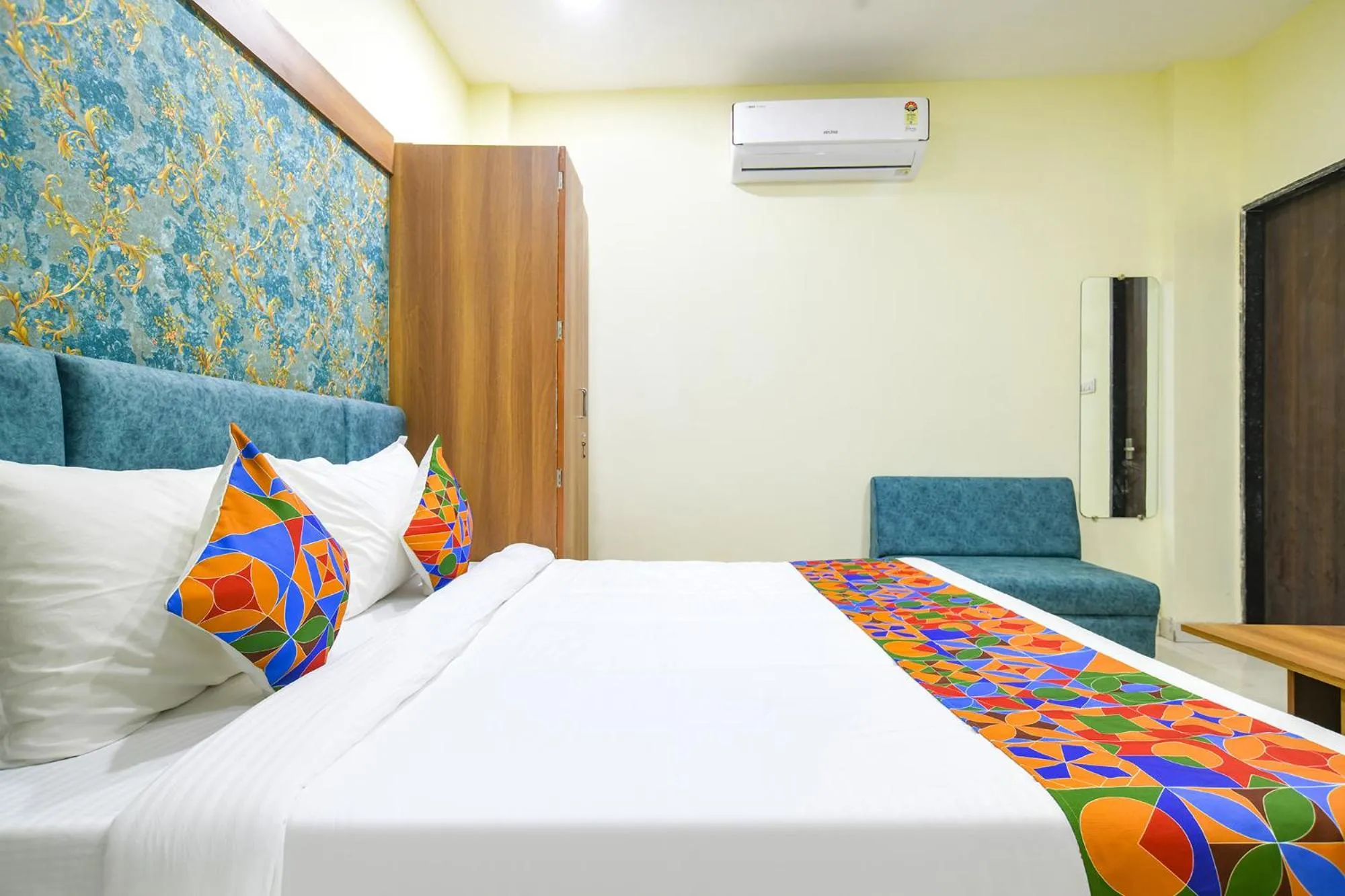 Bed in FabHotel Grand Giriraj