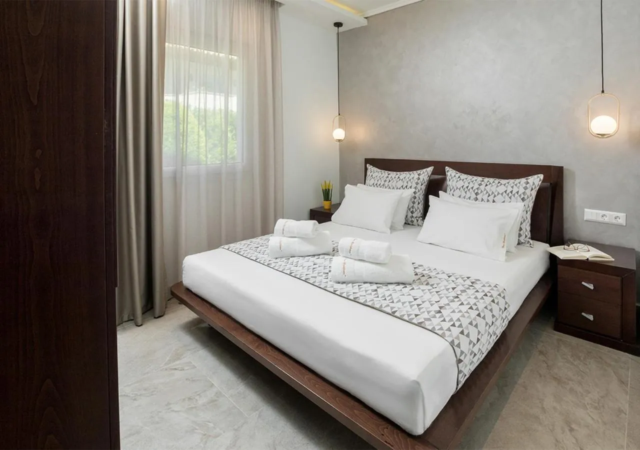 Bed in SUN RESIDENCE Exclusive Seaside Suites