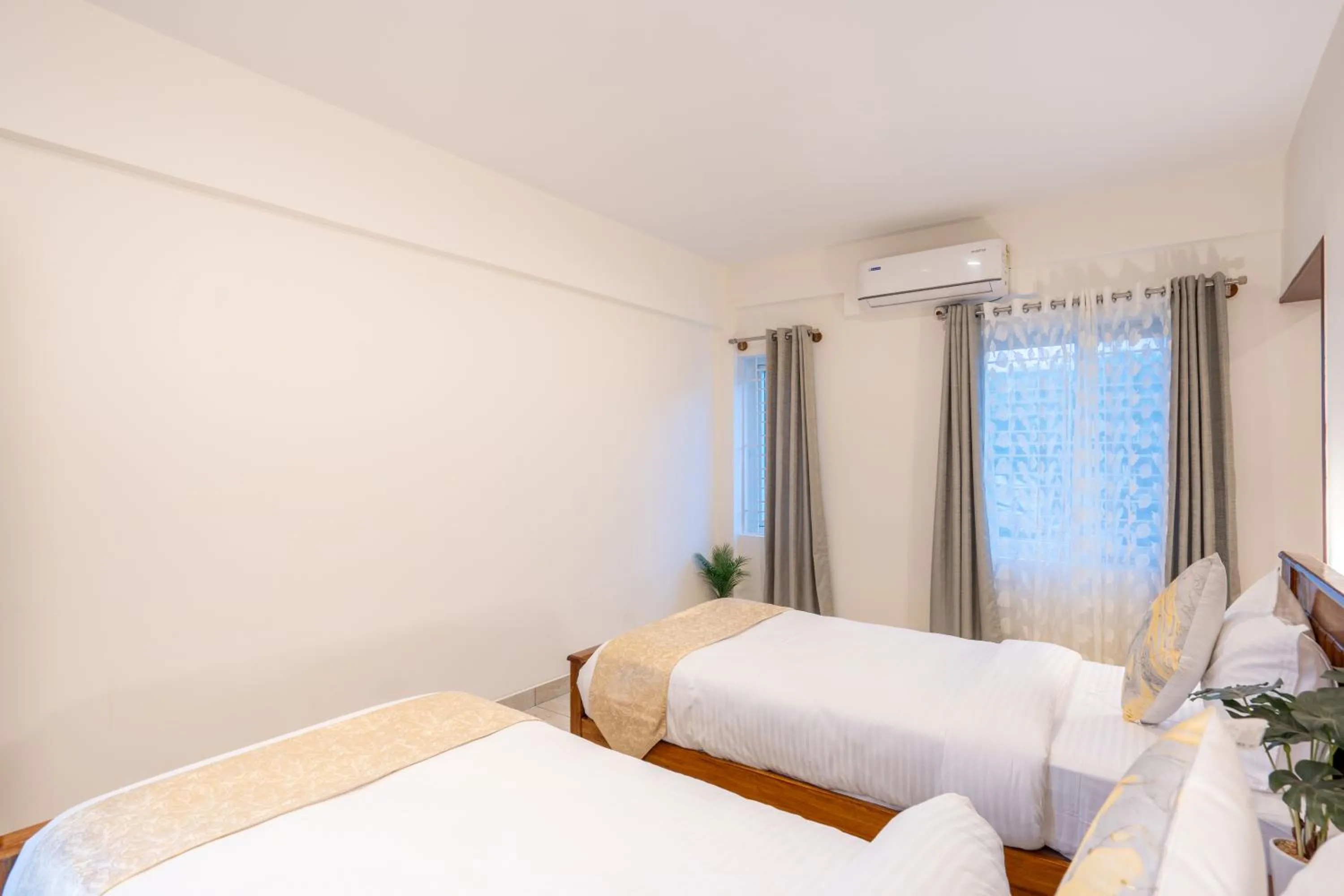 Bed in The Silver Chimes Suites