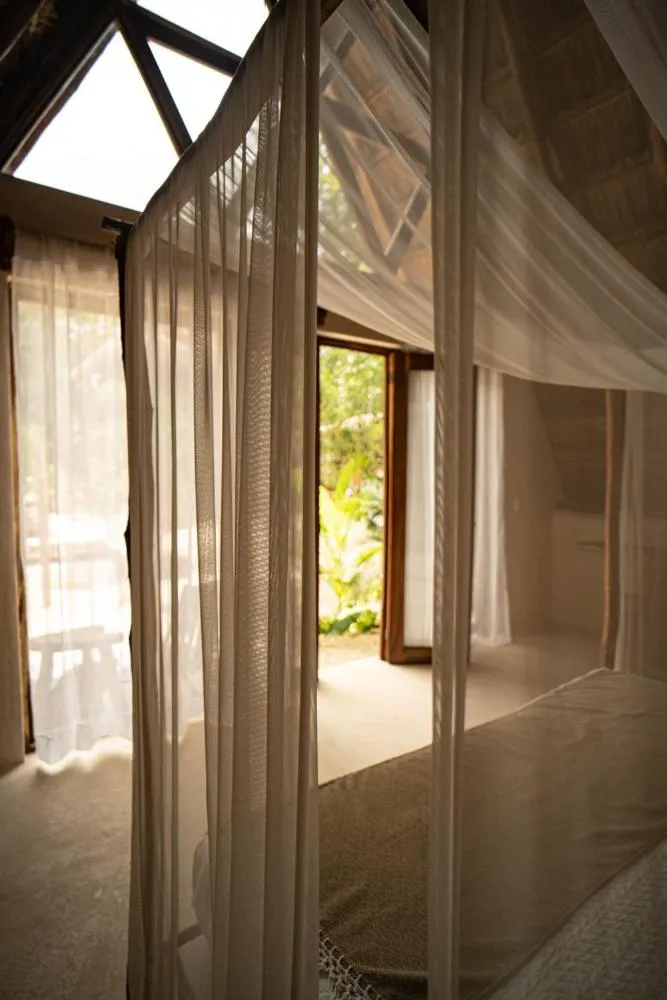 Photo of the whole room, Bed in Lodge Tzunum Jade