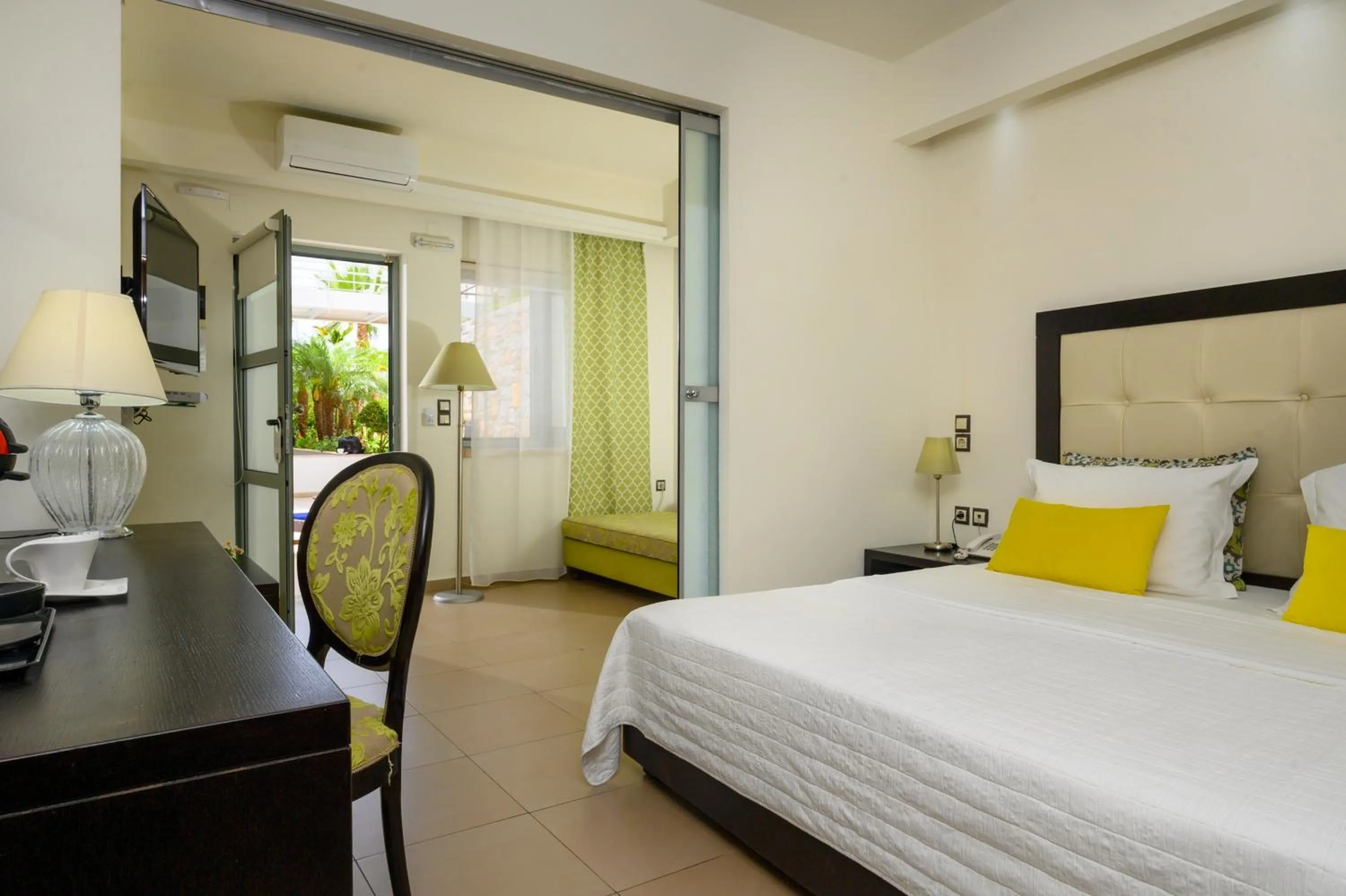 Bed in Angela Suites Boutique Hotel