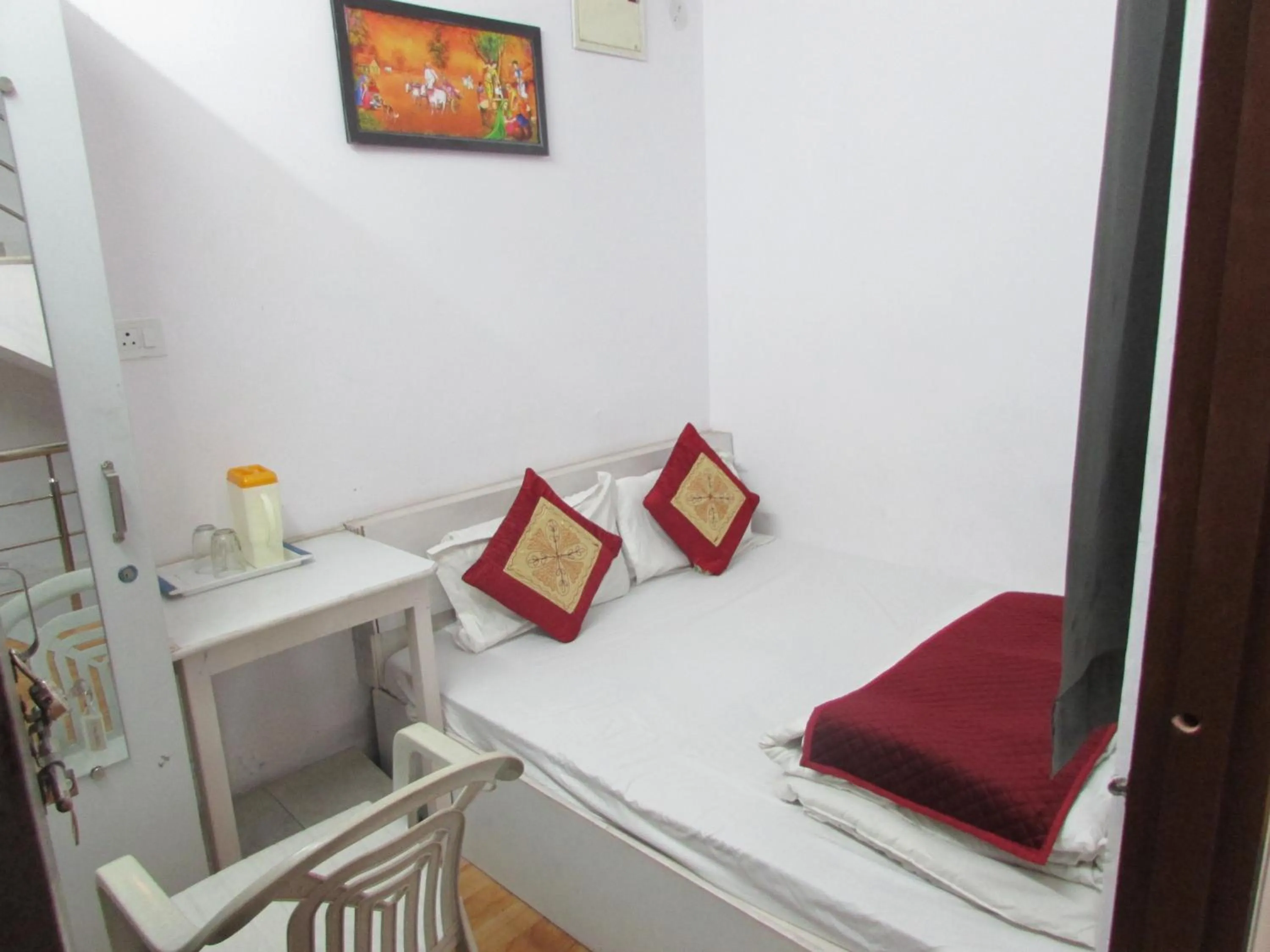 Photo of the whole room, Bed in Ashish Guest House, Udaipole