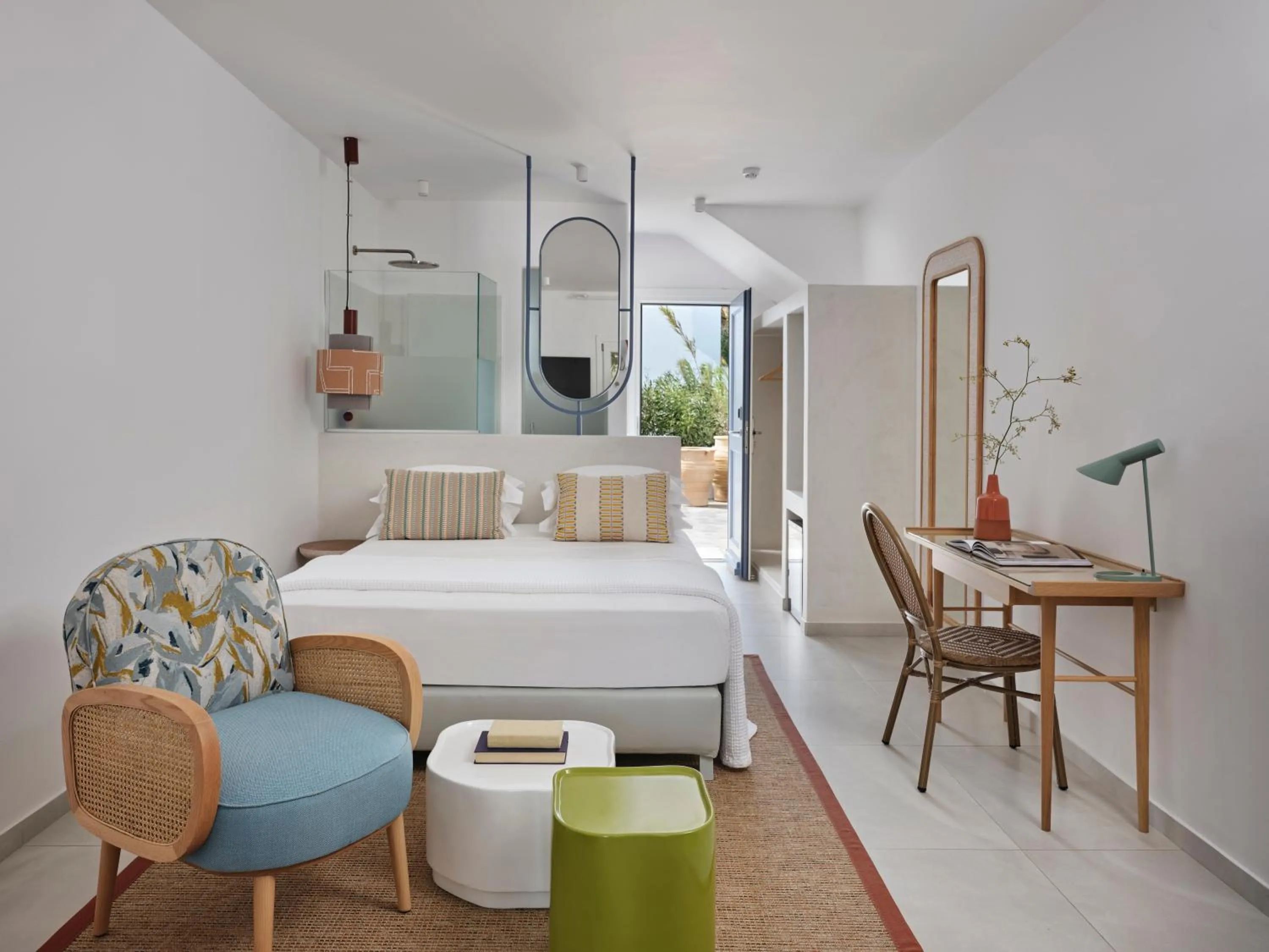 Bed in Myconian Sunrise Relais & Chateaux Hotel