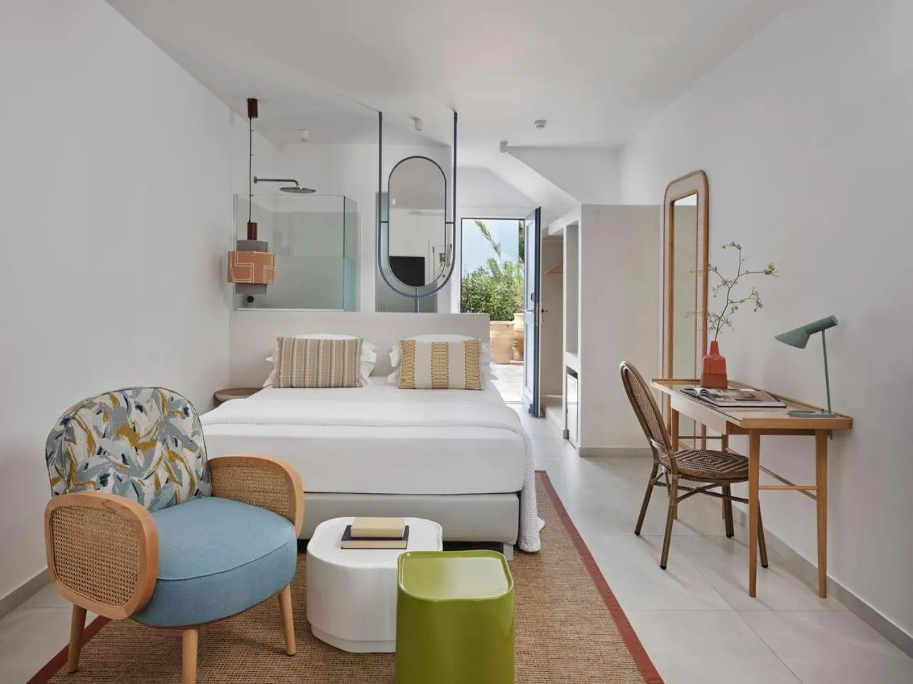 Bed in Myconian Sunrise Relais & Chateaux Hotel