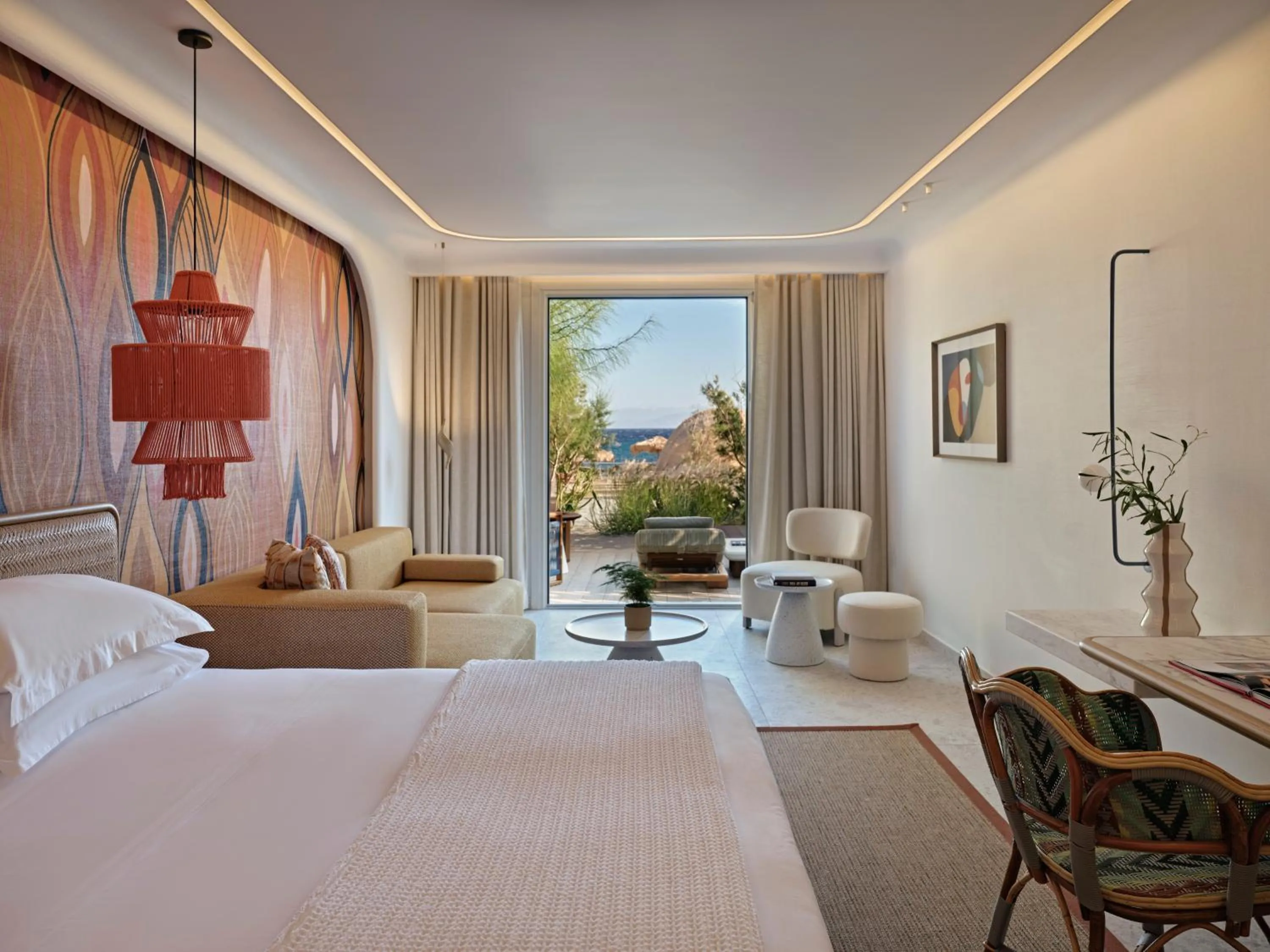 Bed in Myconian Sunrise Relais & Chateaux Hotel