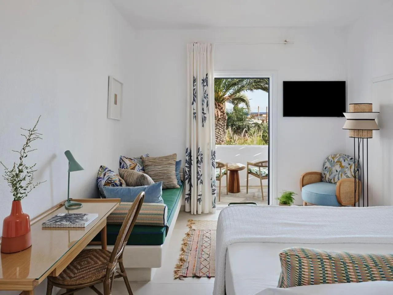 Bed in Myconian Sunrise Relais & Chateaux Hotel