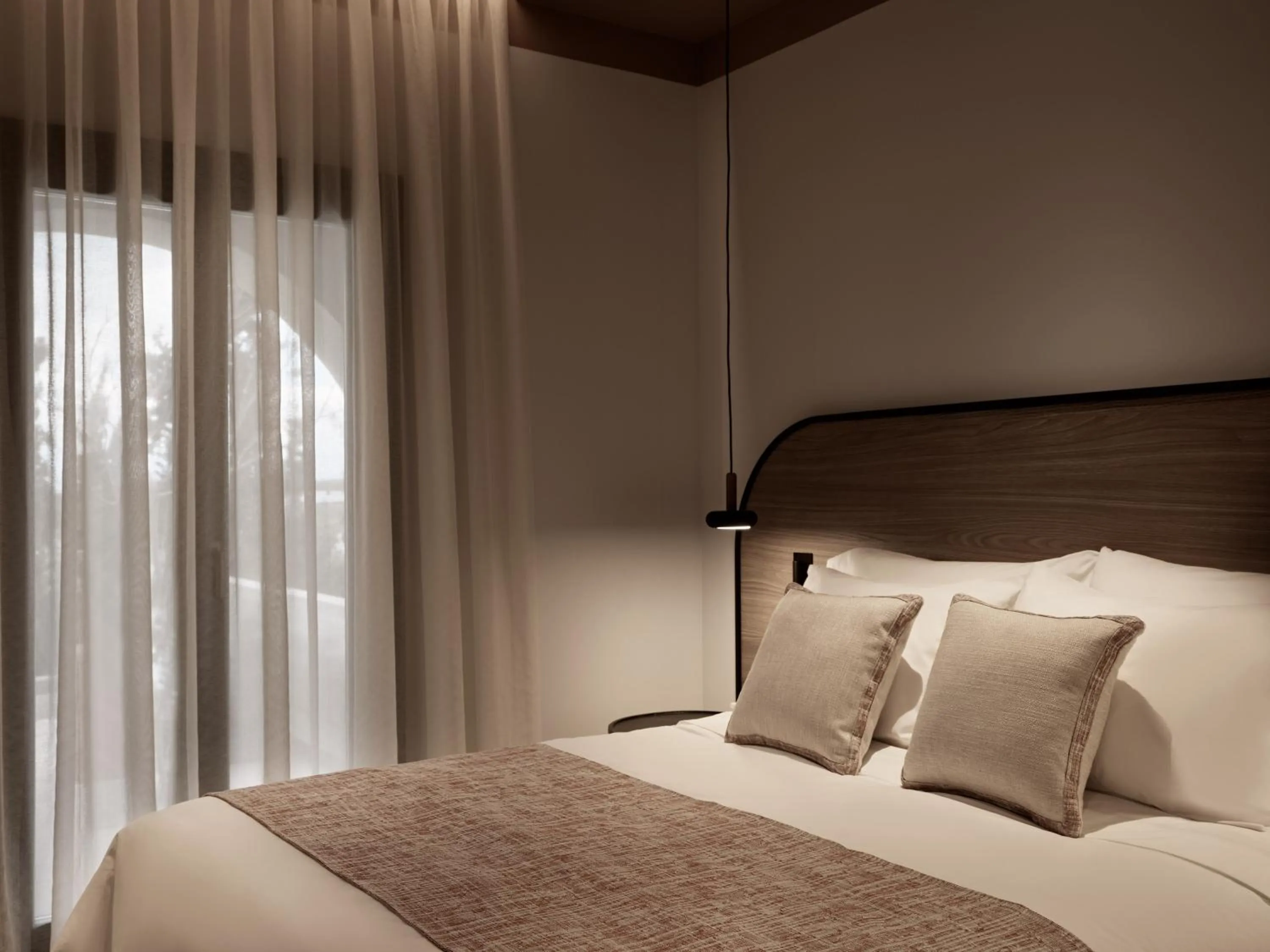 Bed in NAUMA PAROS Design Boutique Hotel