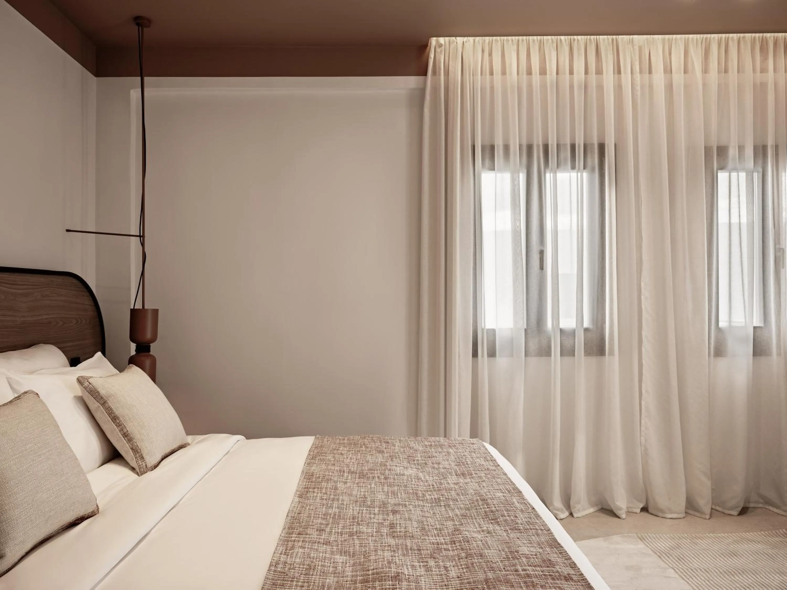 Bed in NAUMA PAROS Design Boutique Hotel