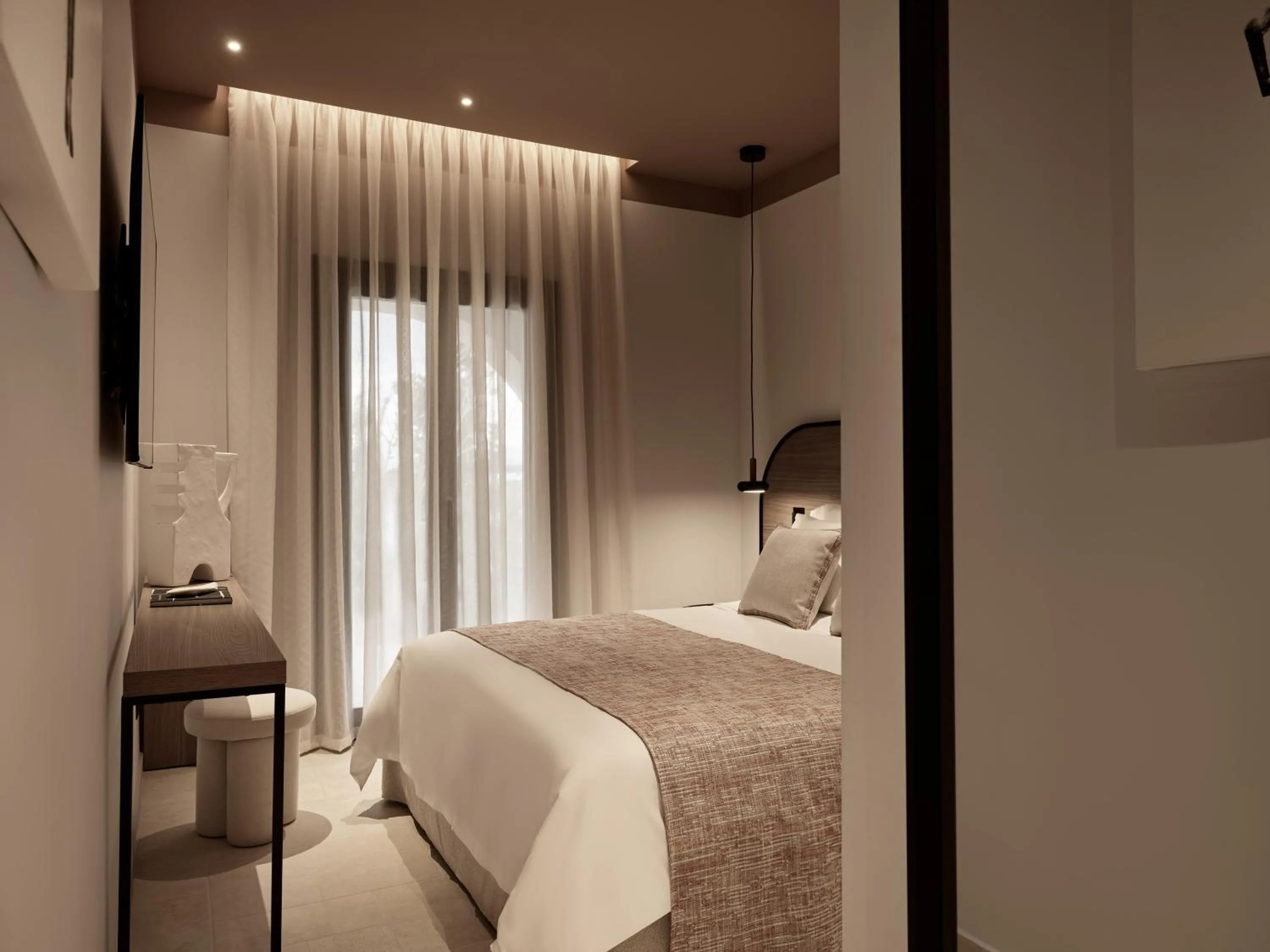 Bed in NAUMA PAROS Design Boutique Hotel