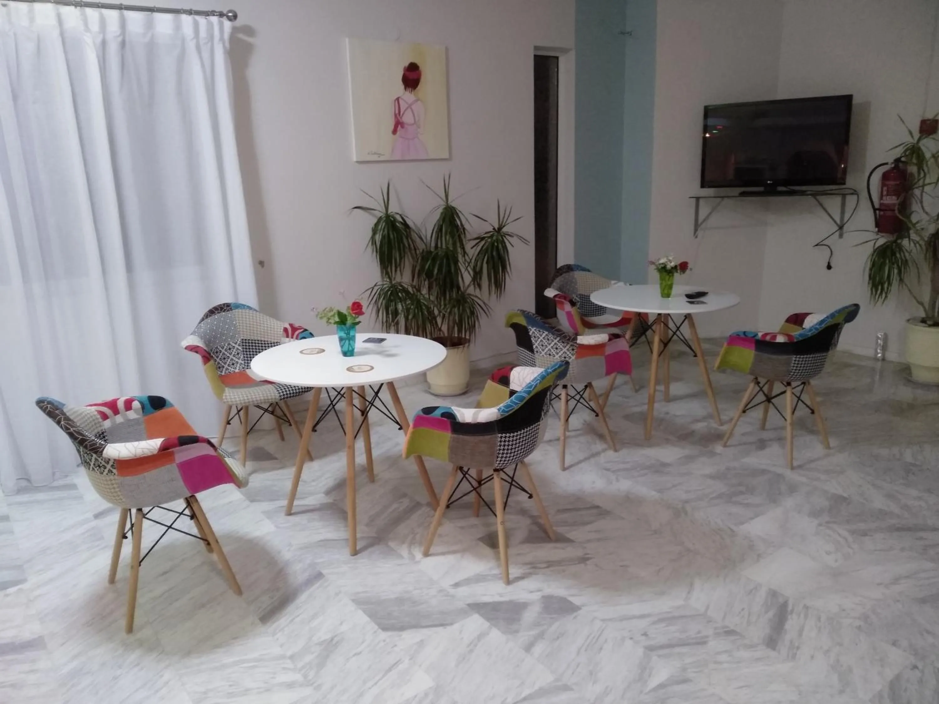 Communal lounge/ TV room in Leonidas Hotel & Studios