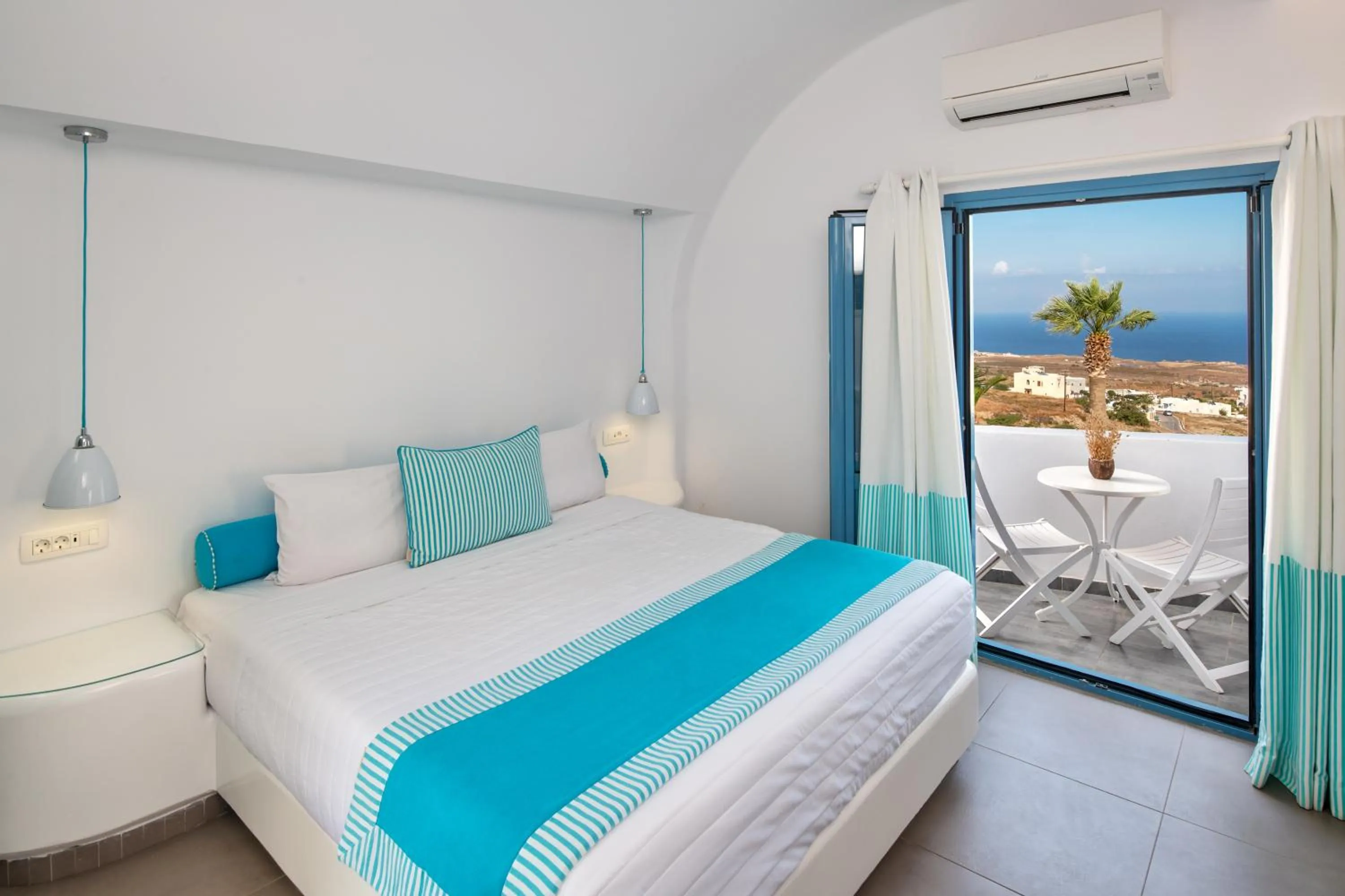 Bed in Evgenia Villas & Suites by Calm Collection