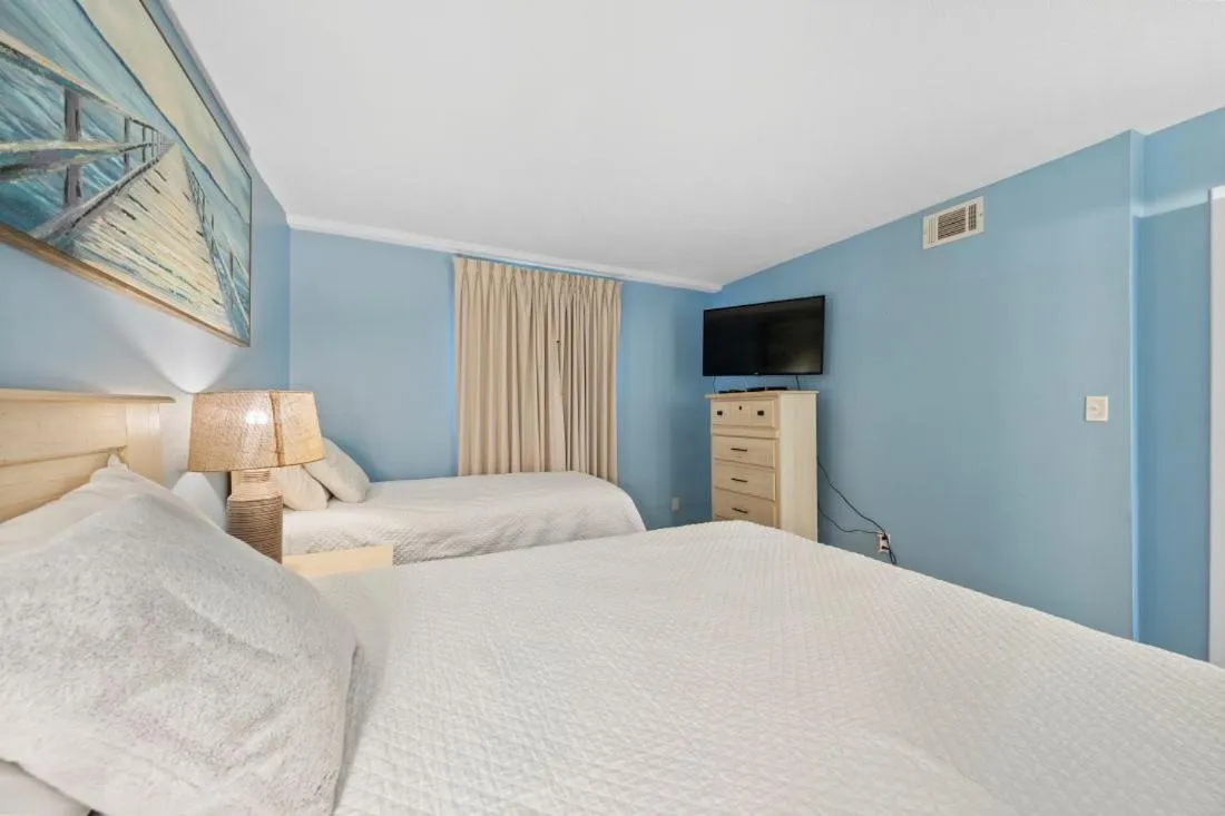 Bed in Romar Tower 7C by Youngs Suncoast