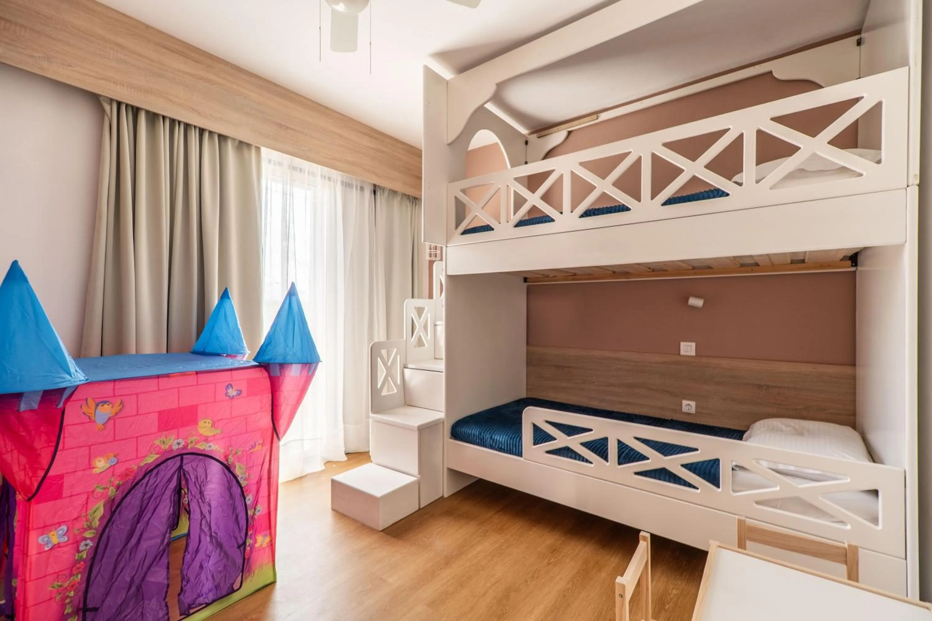 Bed in Paradisio Baby & Kinder Apartments
