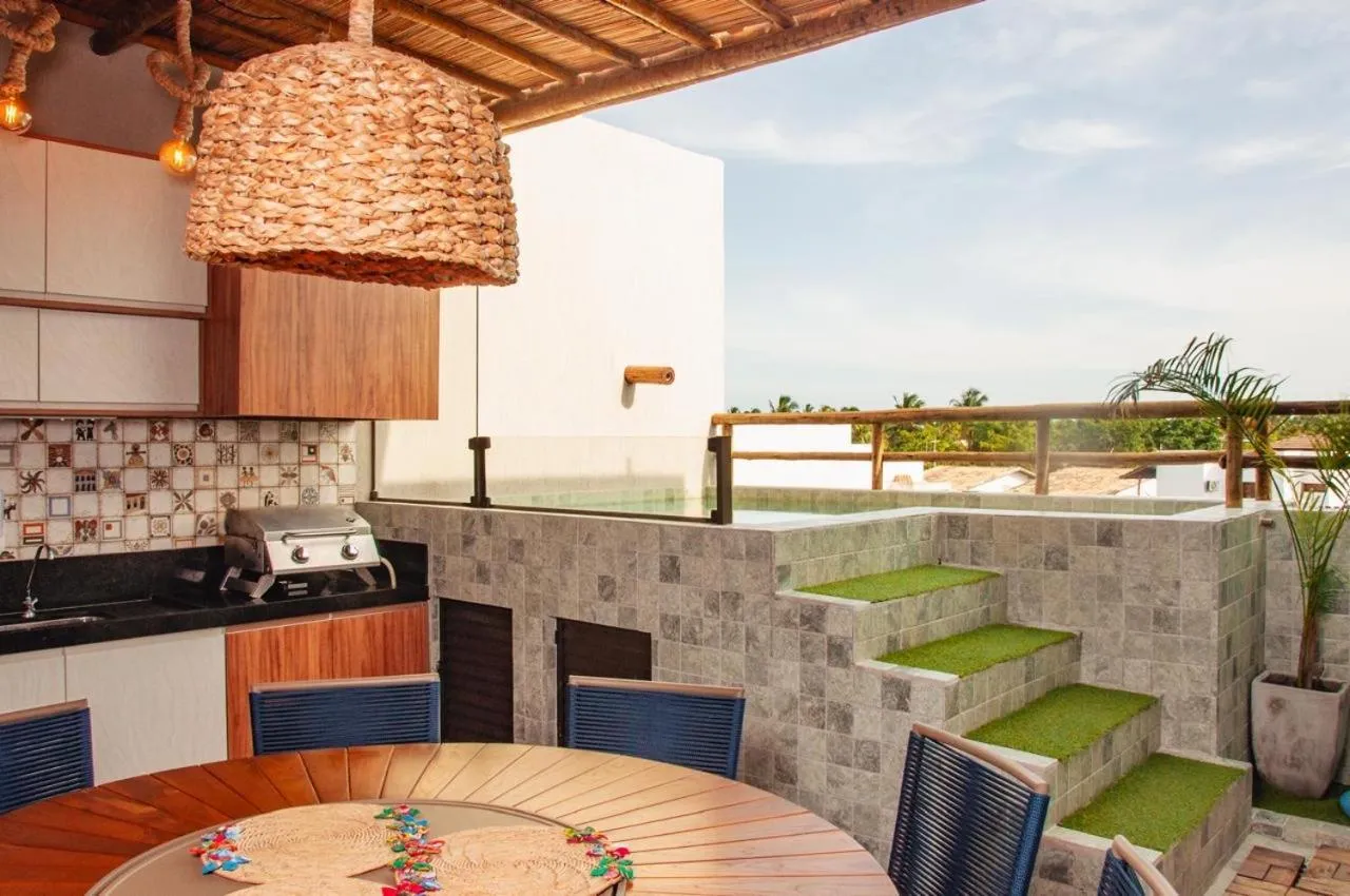 BBQ facilities in Temporada Areia e Mar Triplex com piscina privativa e área gourmet a 250m da Praia do Patacho