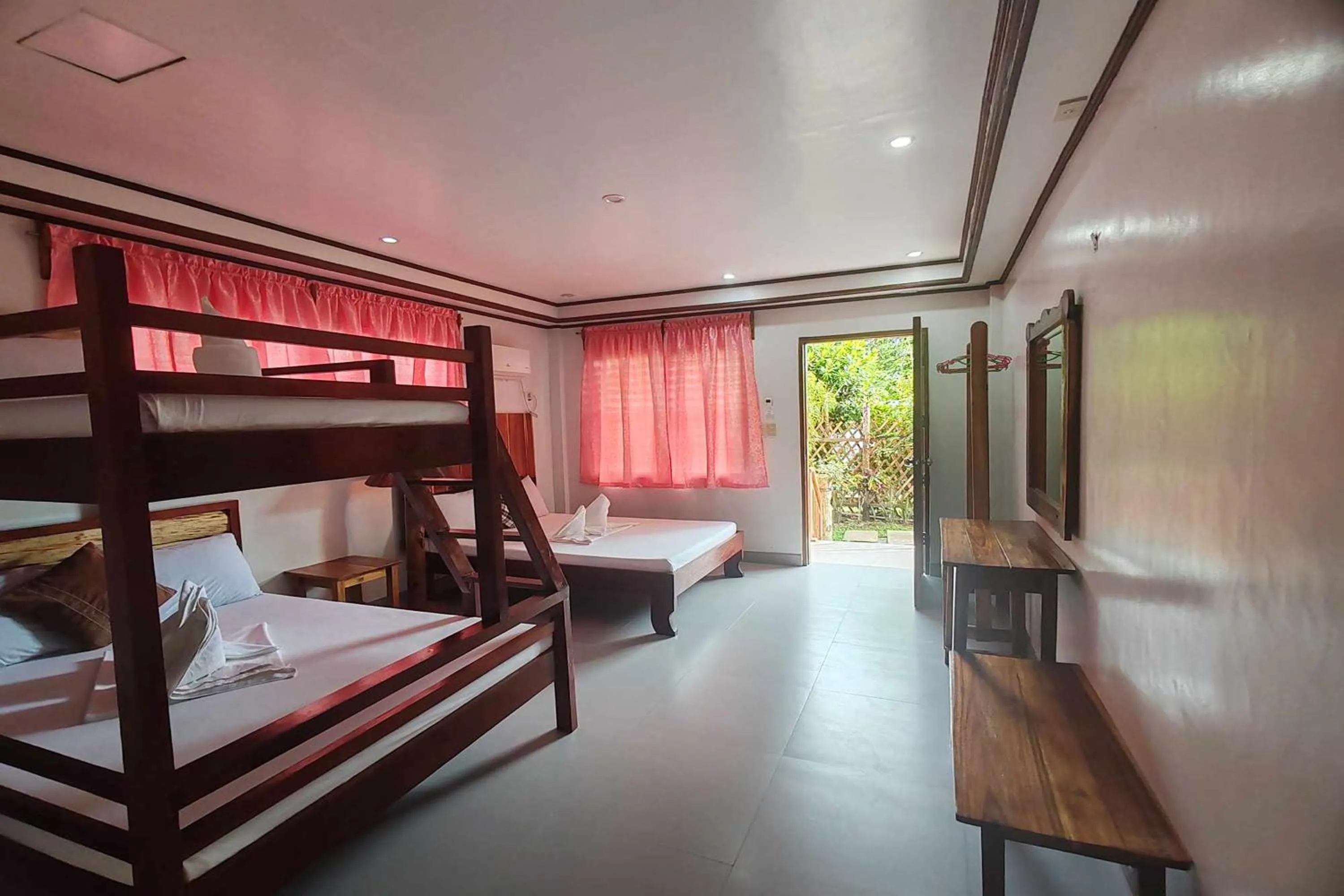 Bed in Summer Homes Beach Front Resort and Cottages Port Barton