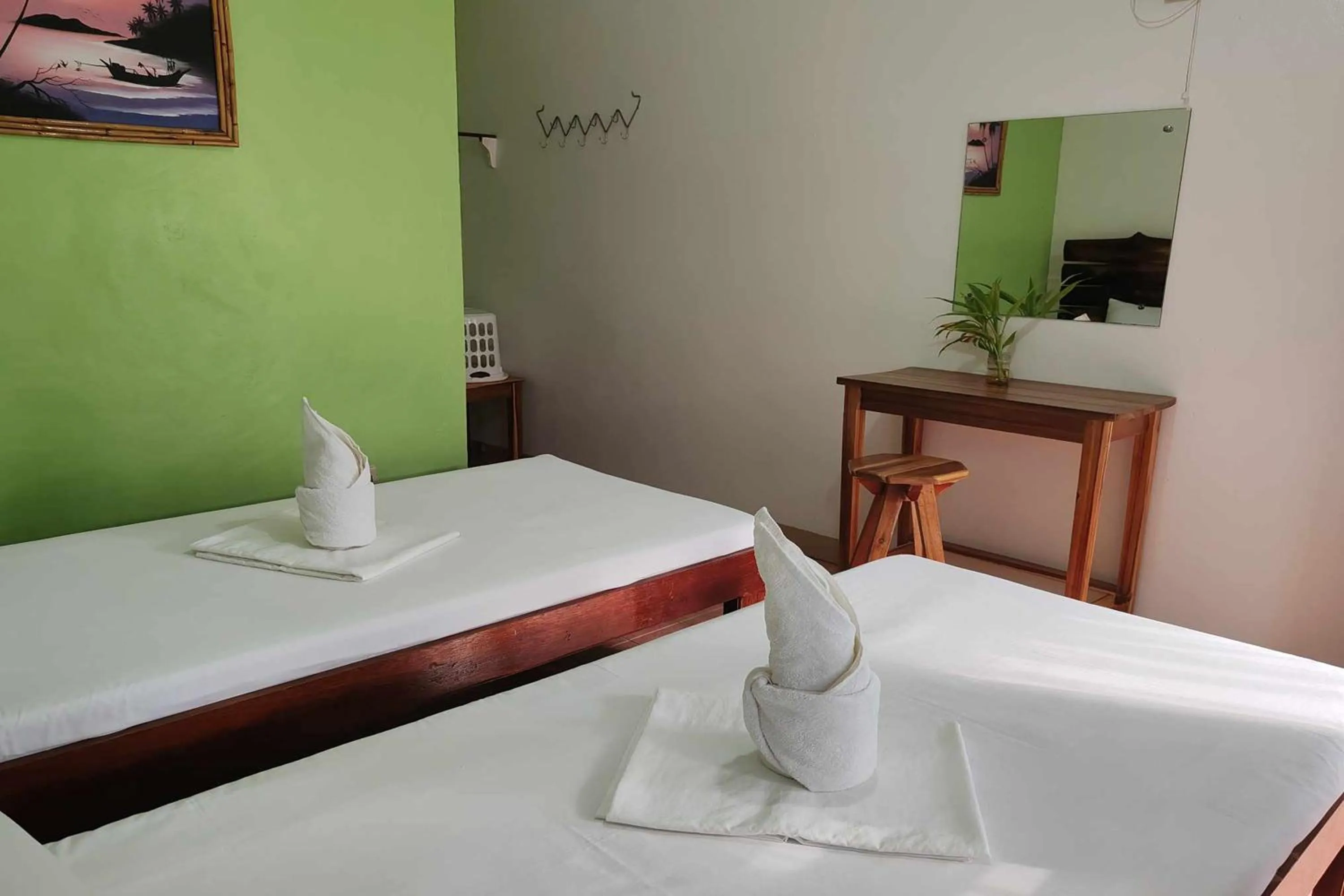 Bed in Summer Homes Beach Front Resort and Cottages Port Barton