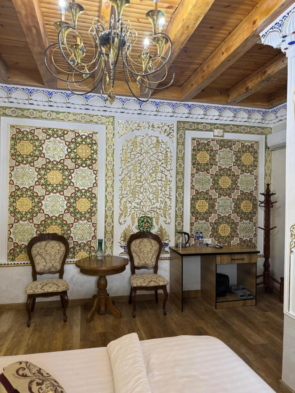 Seating area, Bed in Central Asia Hotel