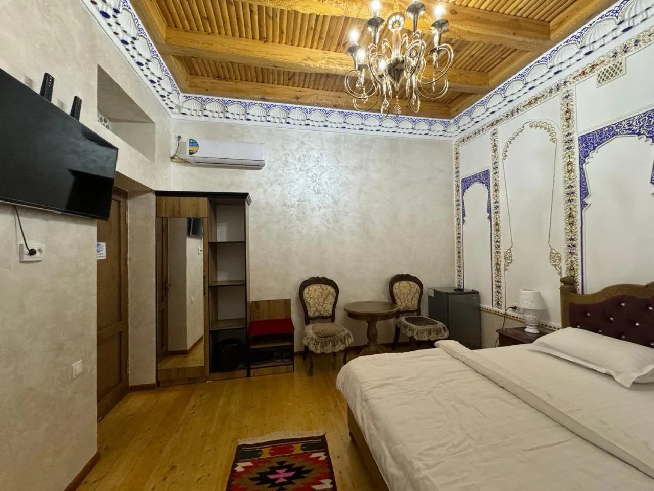 Living room, Bed in Central Asia Hotel