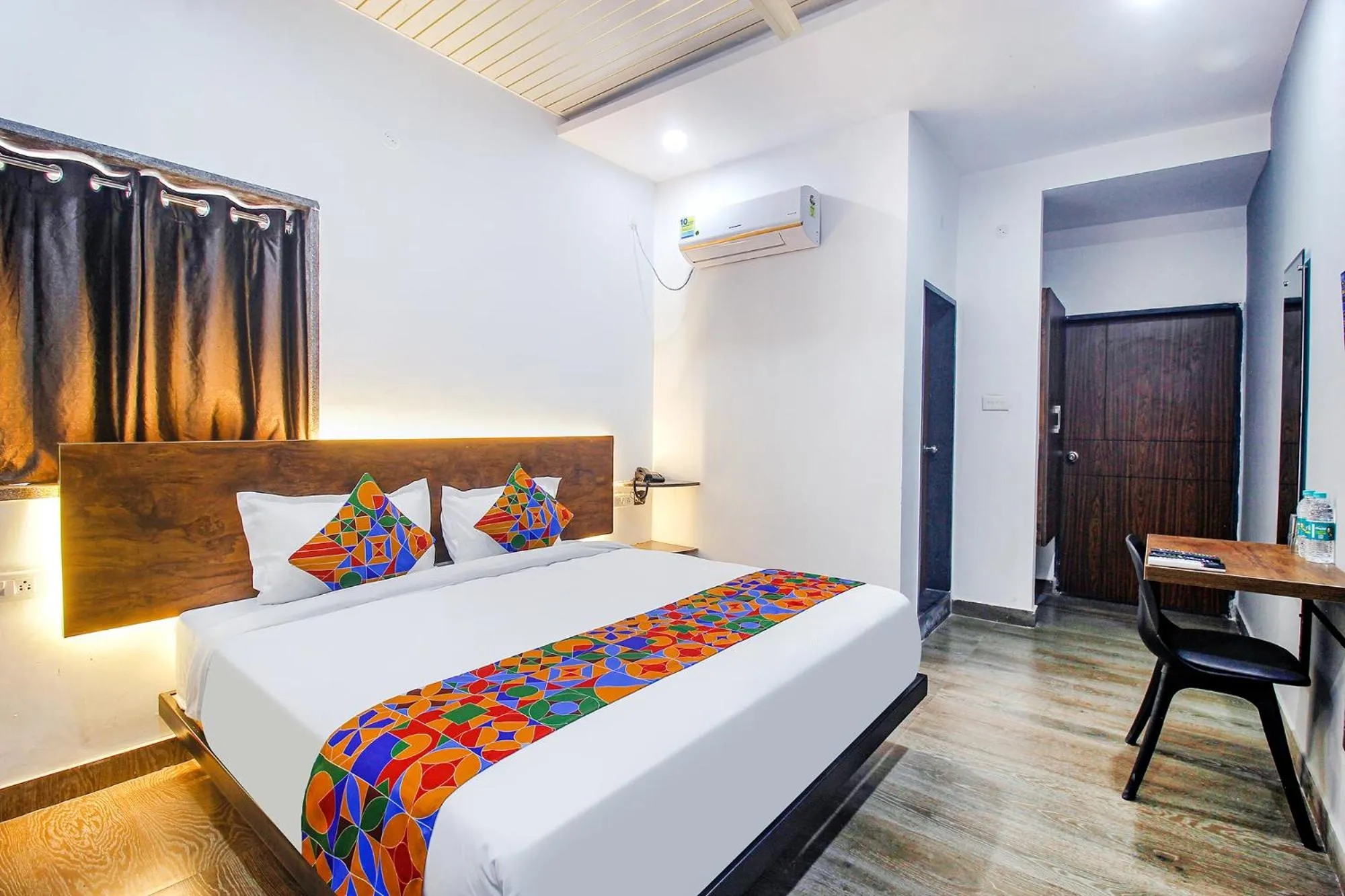 Living room, Bed in FabHotel W Grand Suites