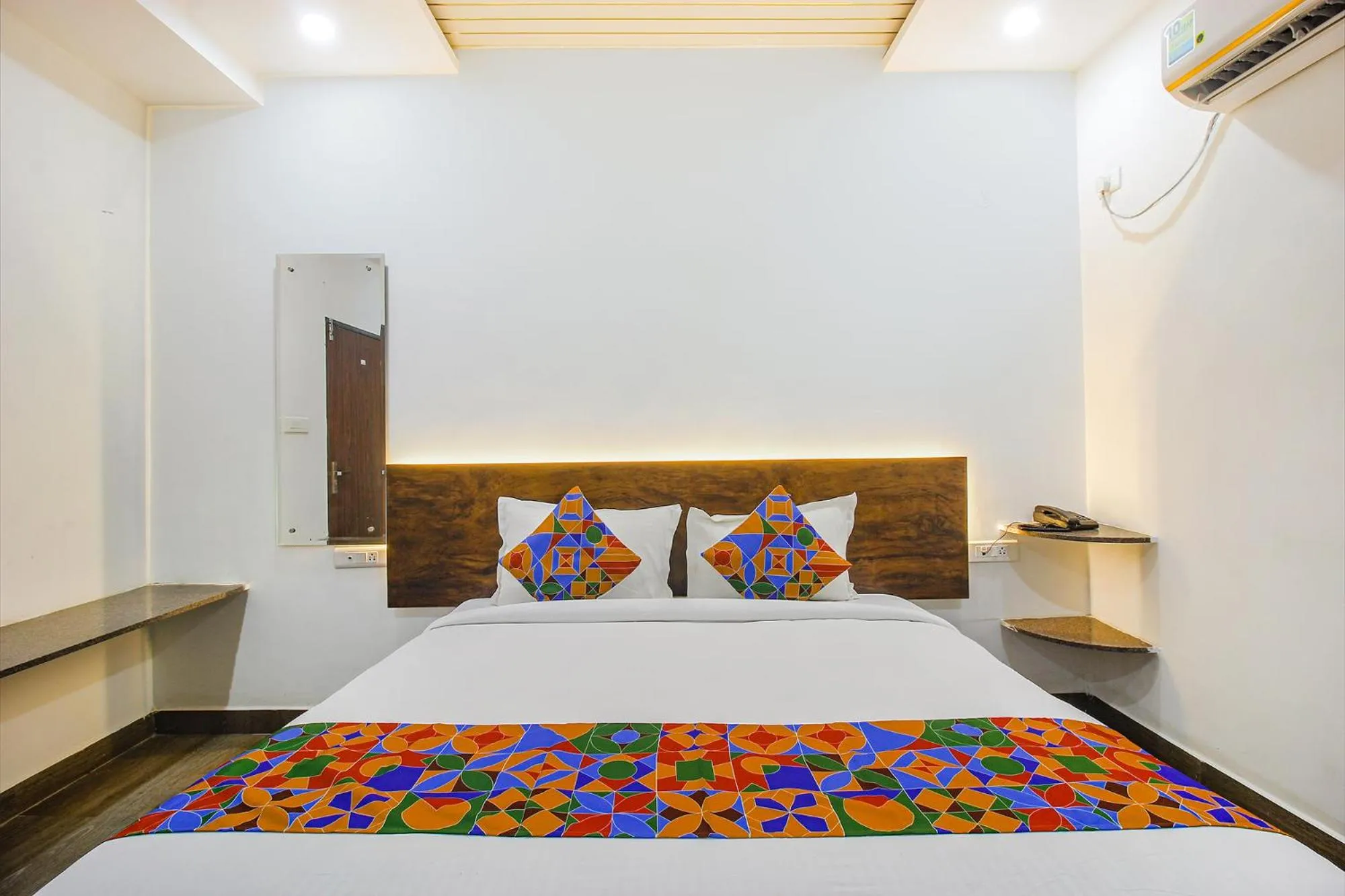 Bed in FabHotel W Grand Suites