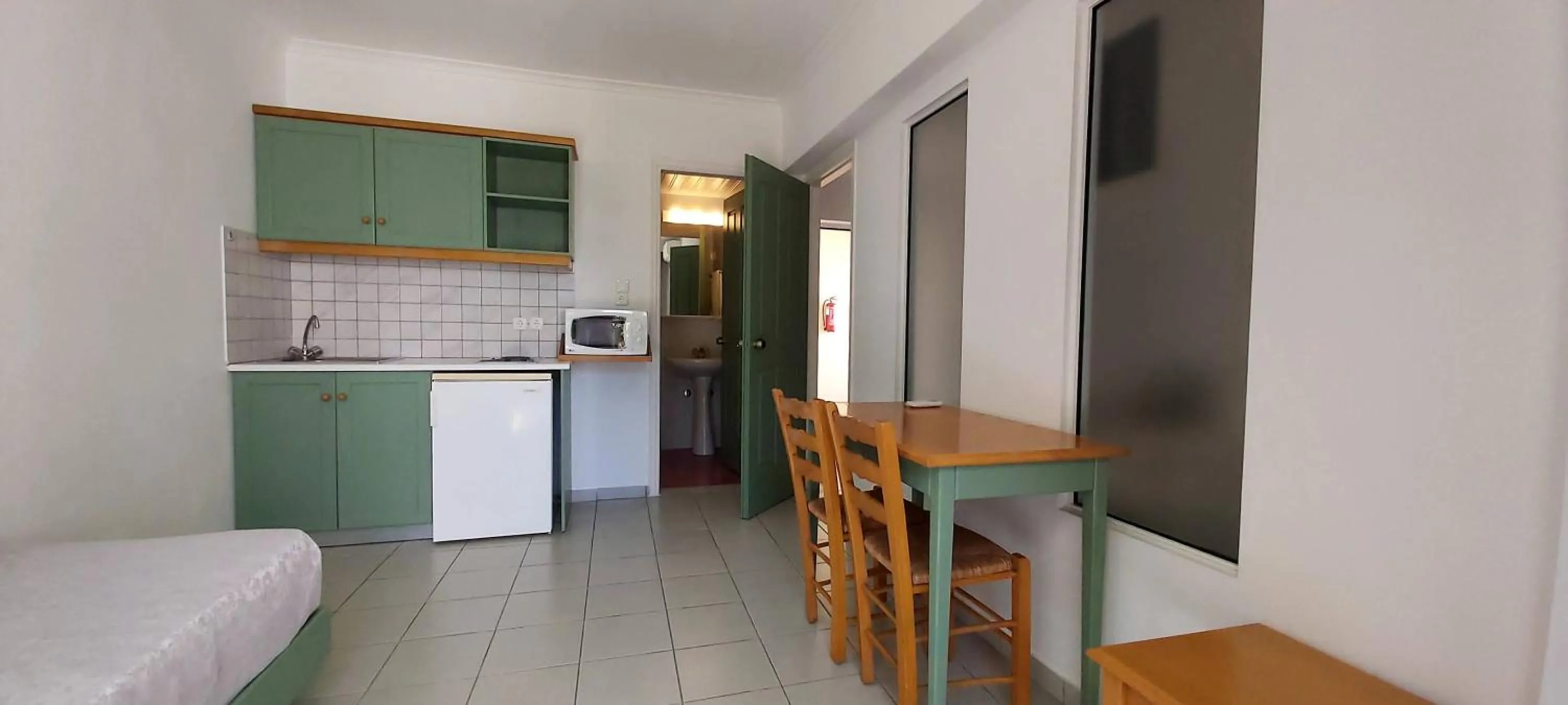 Kitchen or kitchenette in Andromeda Hotel Apartments
