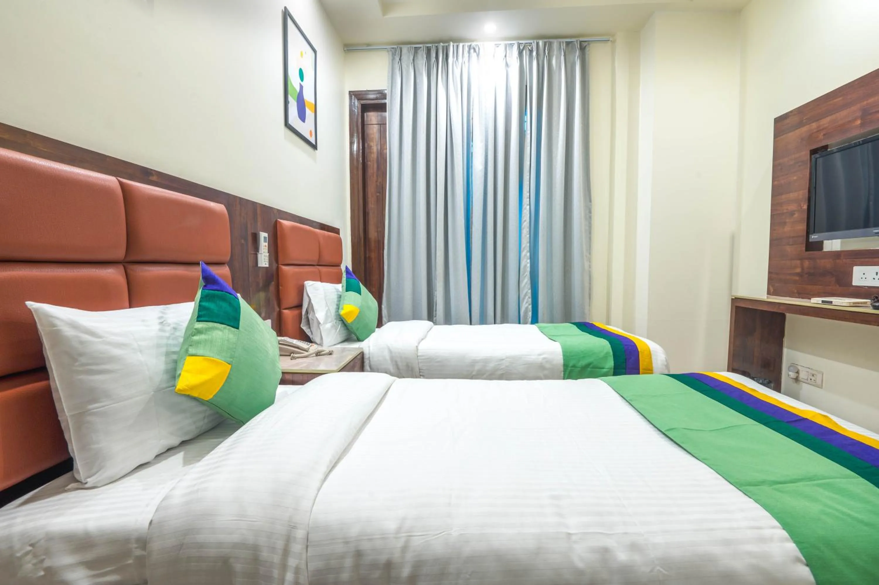 Bedroom, Bed in Treebo Sunny Feast