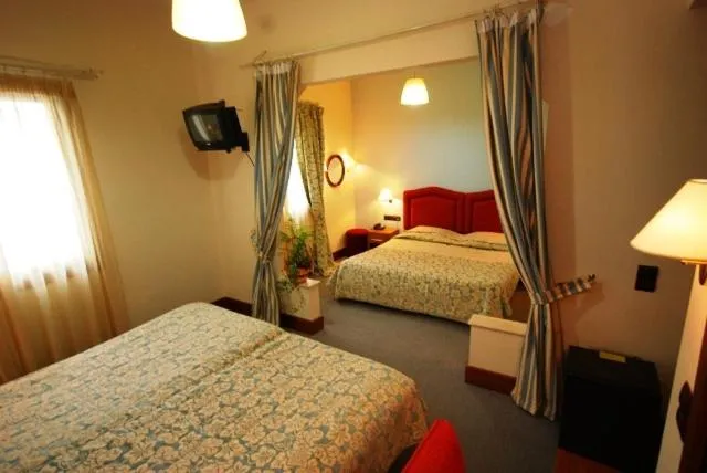 Bed in Hotel Elvetia