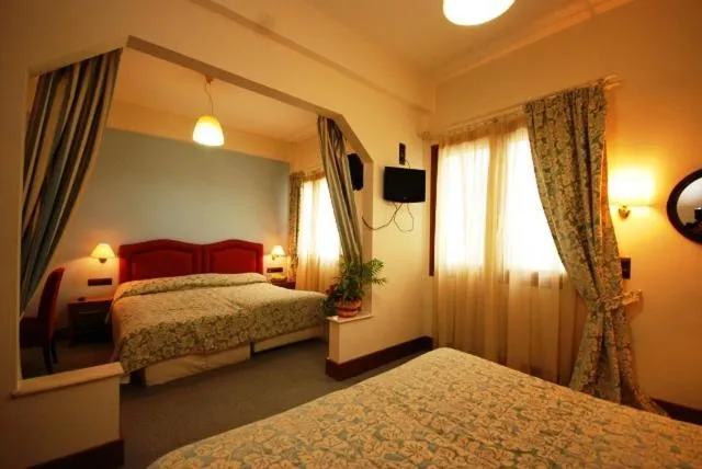 Bed in Hotel Elvetia